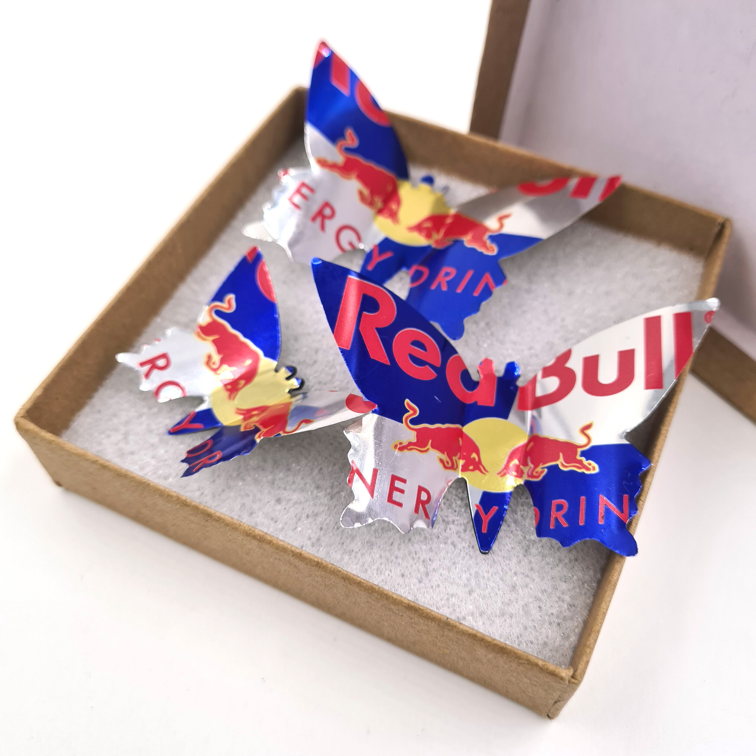 Three blue red and silver eco Redbull Butterfly Can Magnets 