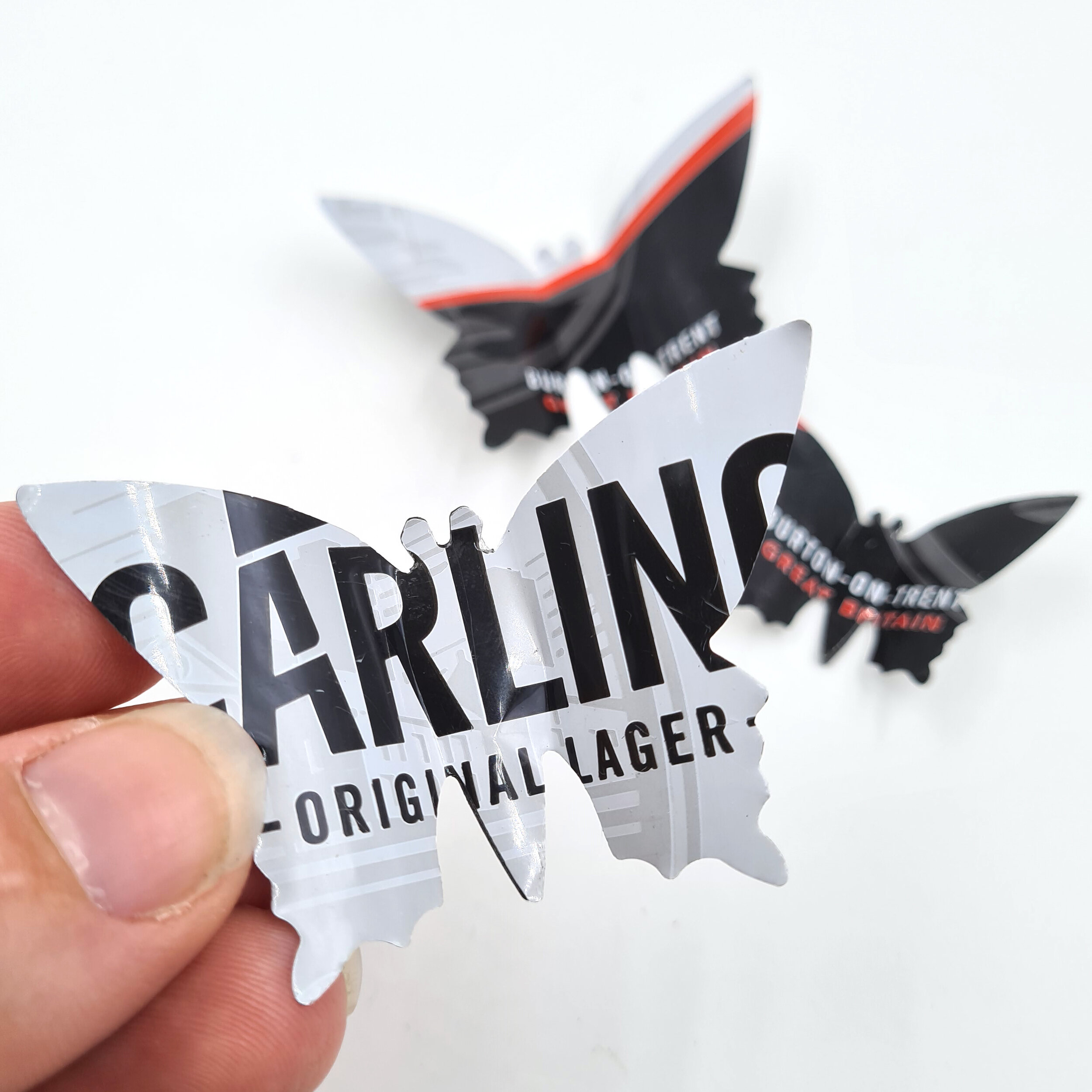 Carling black red and white eco Butterfly Can Magnets holding