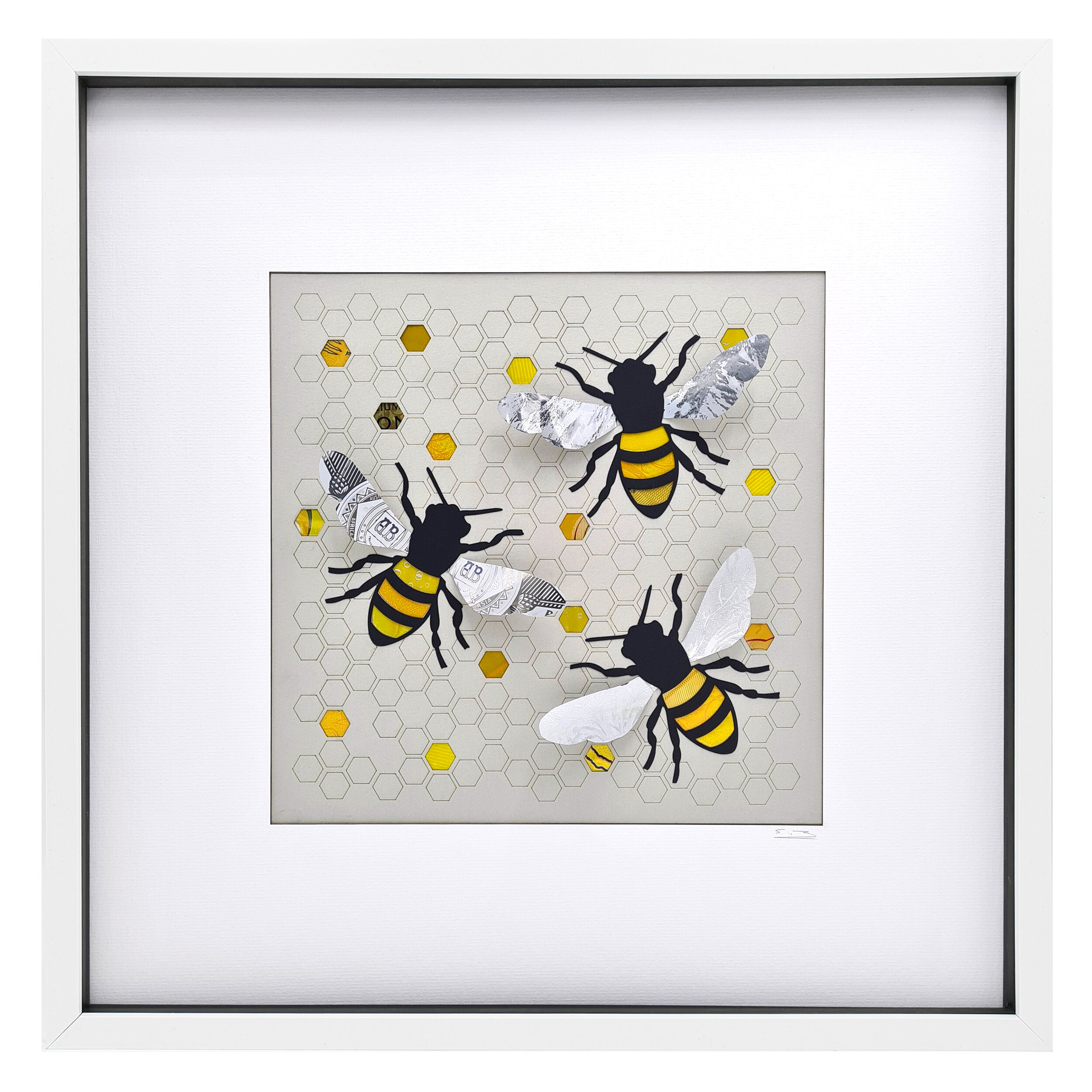 Large framed artwork of bumble bees made from waste drinks cans