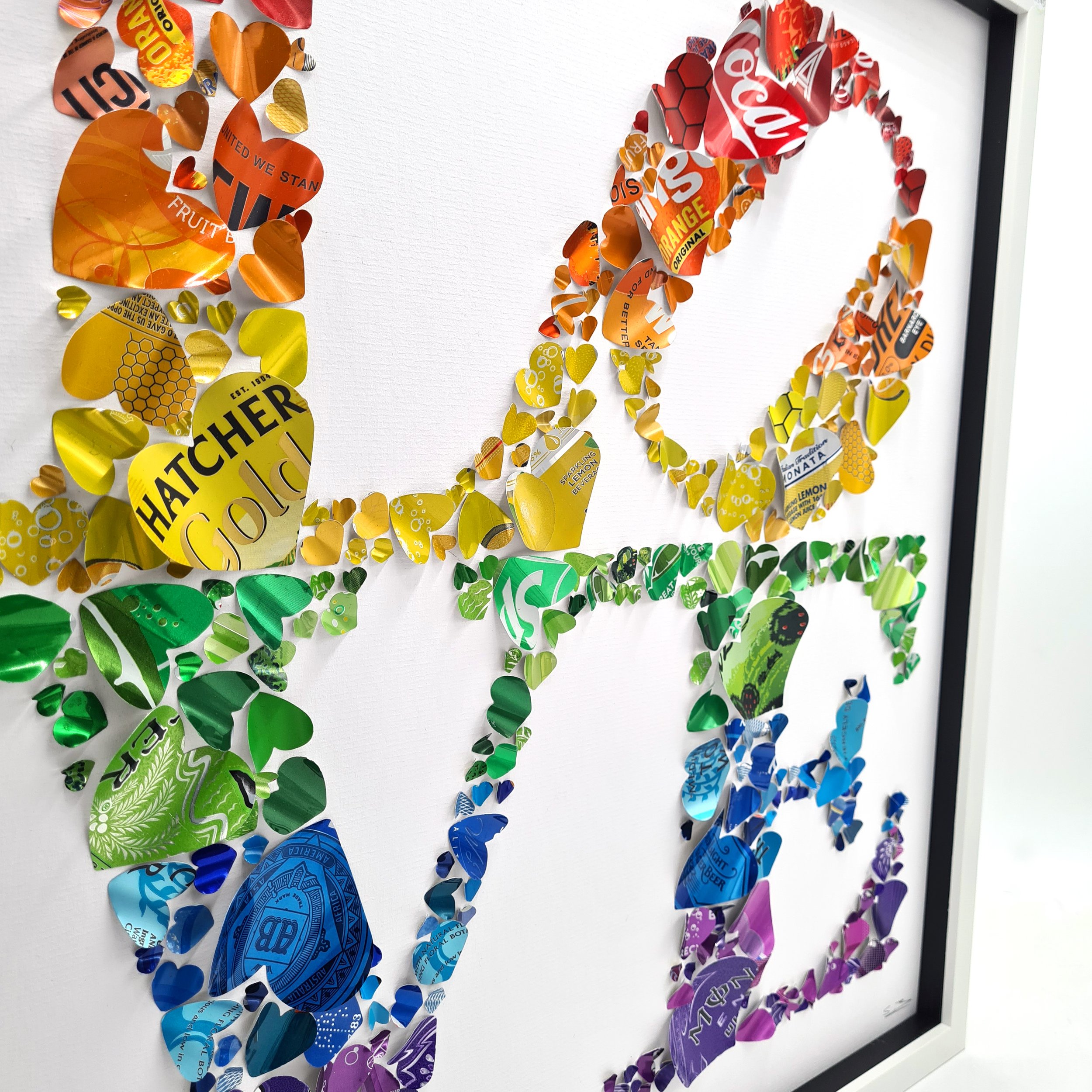 Robert Indiana's Love sculpture made from rainbow coloured aluminium cans