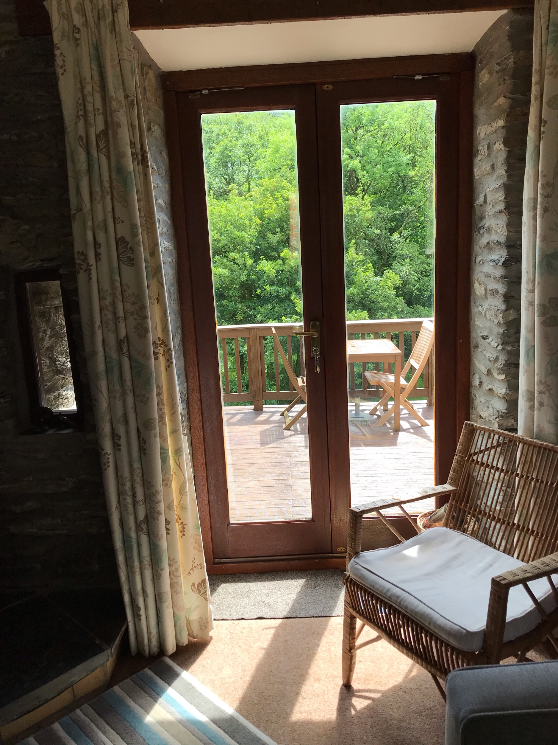 The Coach House living room and view to decking