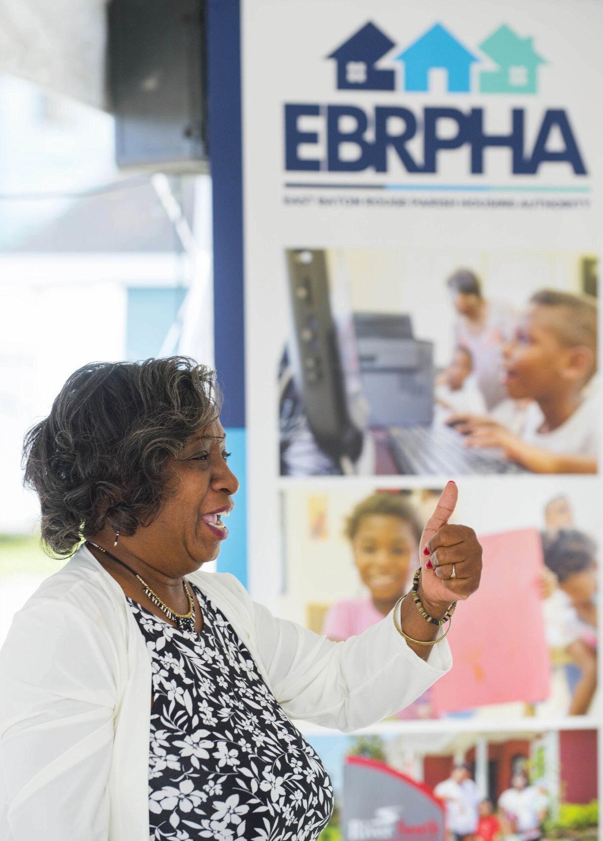  Ardenwood Village residents council secretary Beverly Claborn gives a thumbs-up, during her remarks at a ggathering to celebrate the U.S. Dept. of Housing and Urban Development's (HUD) $29.5 million Choice Neighborhoods Implementation Grant to East 