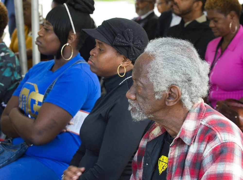  Turner Plaza resident Charles Nellon, right, and Ardenwood Village resident Valencia Stevenson, center listen at a gathering to celebrate the U.S. Dept. of Housing and Urban Development's (HUD) $29.5 million Choice Neighborhoods Implementation Grant