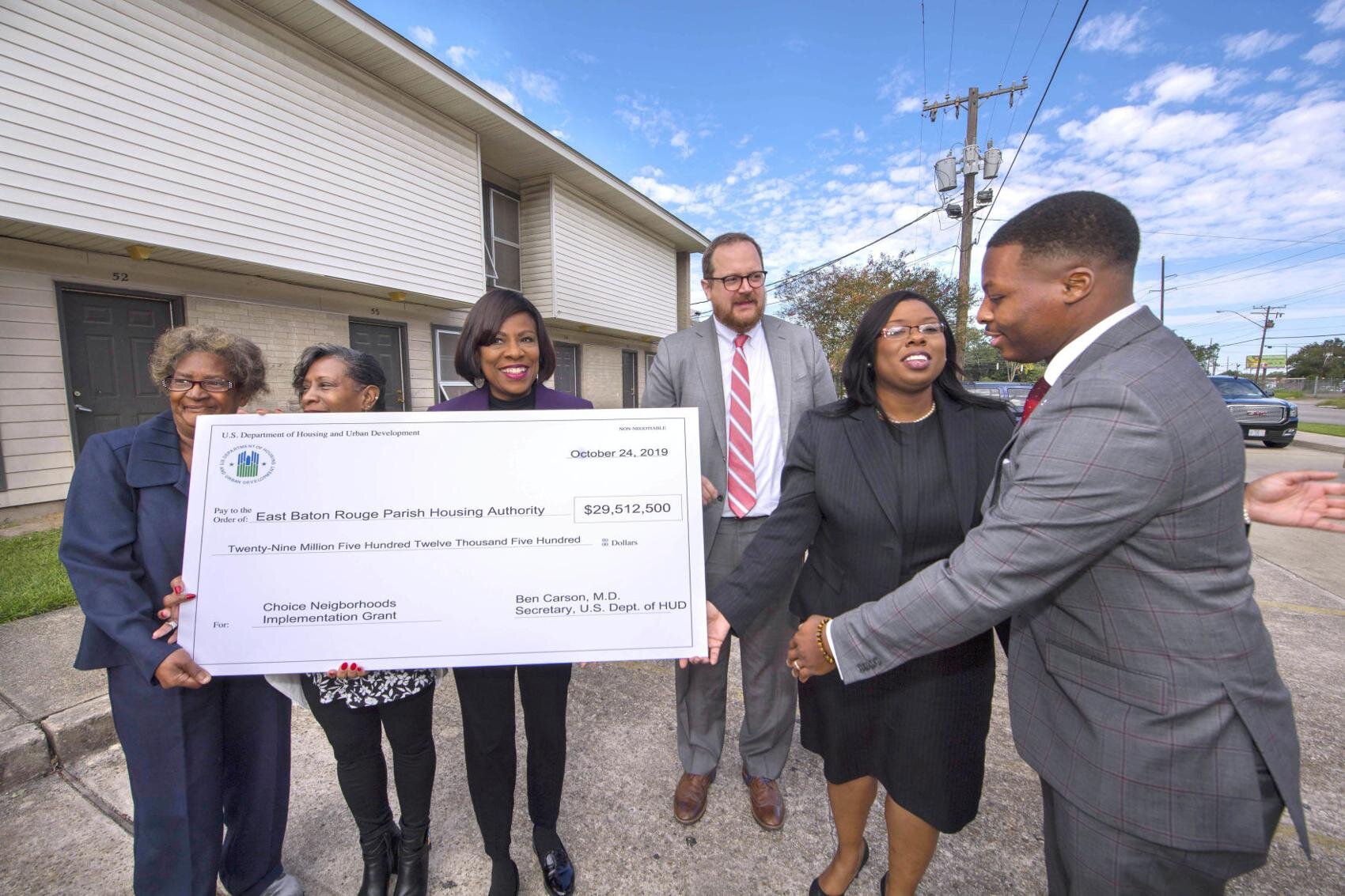  East Baton Rouge Parish Housing Authority CEO J. Wesley Daniels, right, hugs EBR Housing Authority board chairman Dianna Payton, just after they, U.S. Dept. of Housing and Urban Development (HUD) Assistant Secretary for Public and Indian Housing Hun