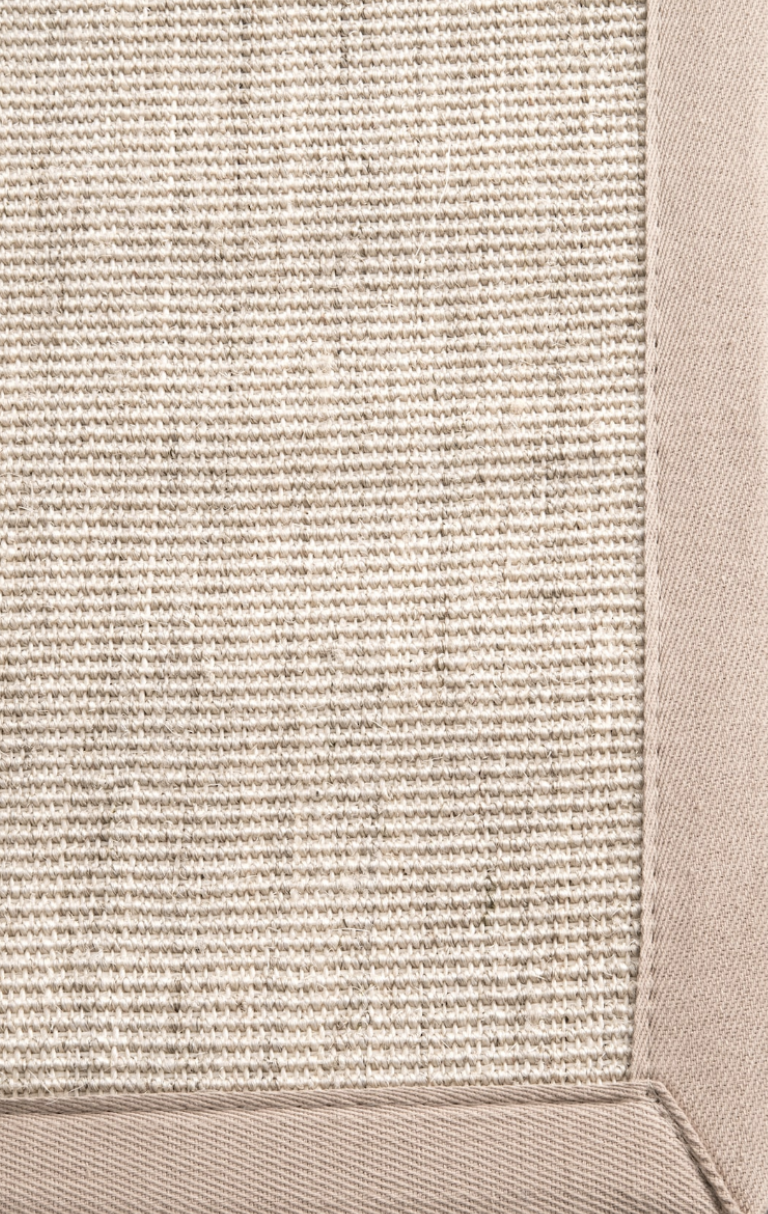 If you find a rug you love, but it’s not quite large enough for your space, consider layering it over a larger seagrass or sisal area rug. These rugs can be relatively inexpensive and provide a nice “frame” for that one-of-a-kind rug you love.