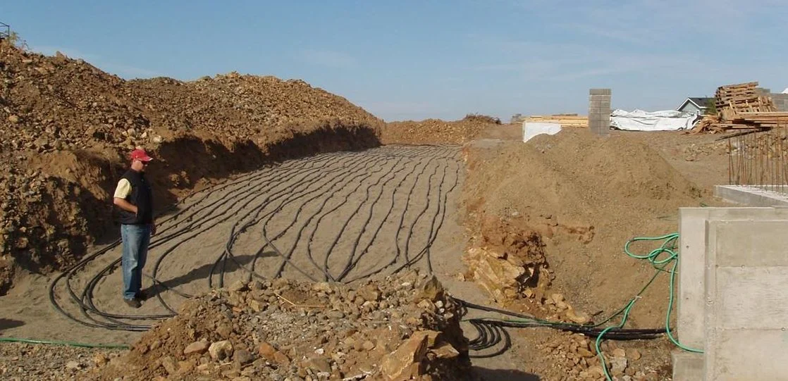 Site-wide sustainable strategies provide the basis for long-term cost savings. This geothermal field was a key integrated system for this net-positive energy home.
