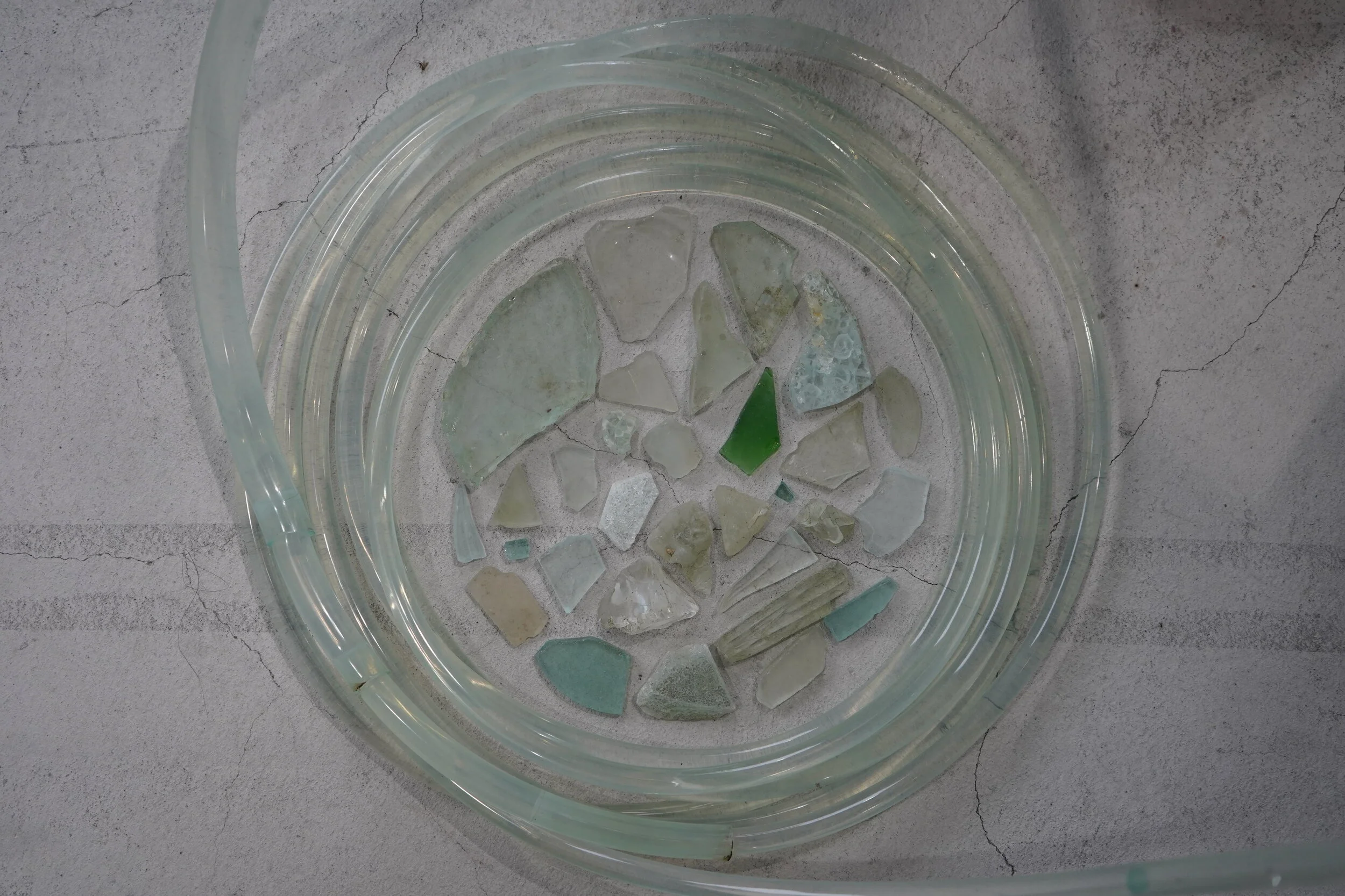  detail: river glass, water, silicone hose 