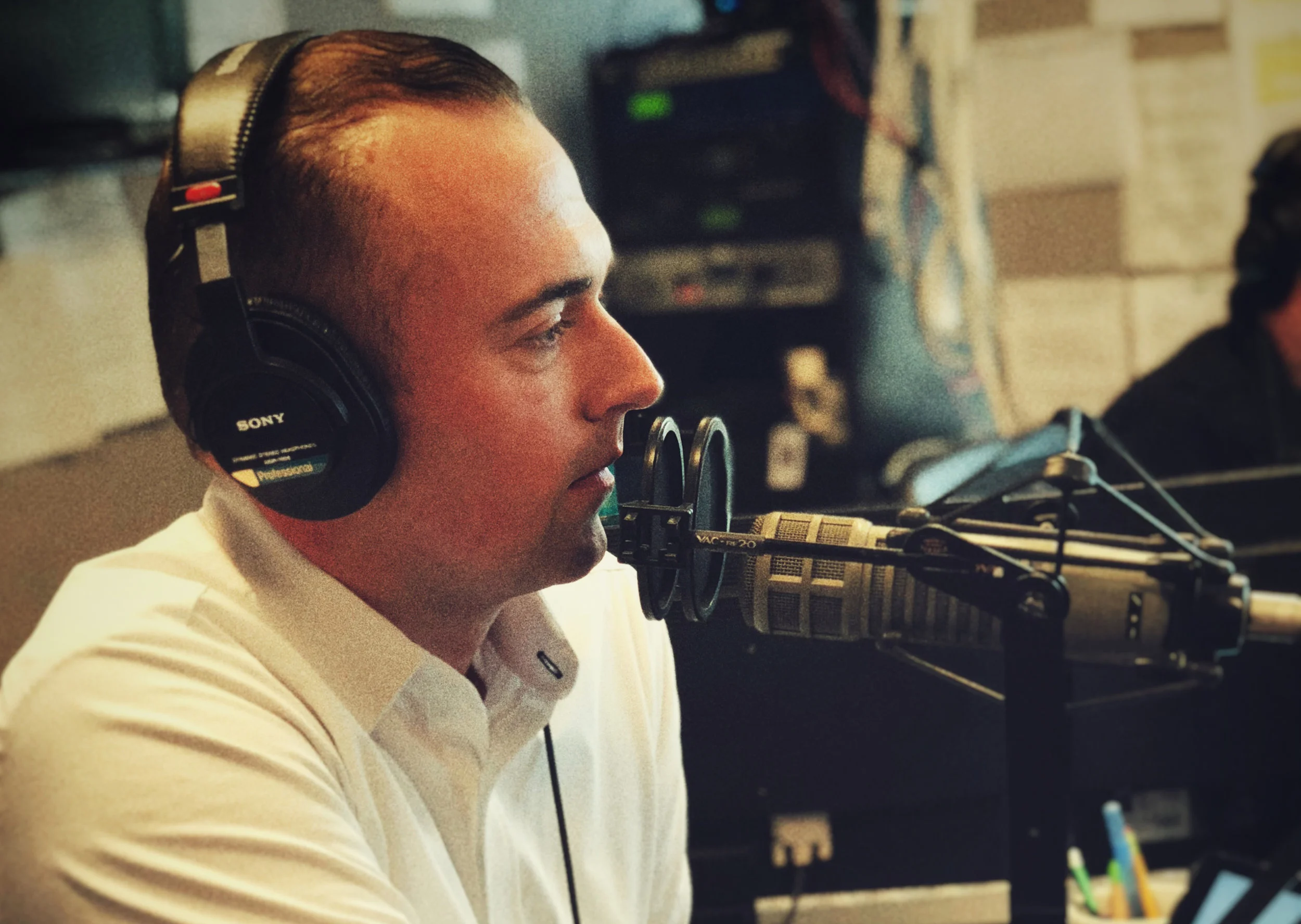 Darren in the radio station Horizontal.jpg