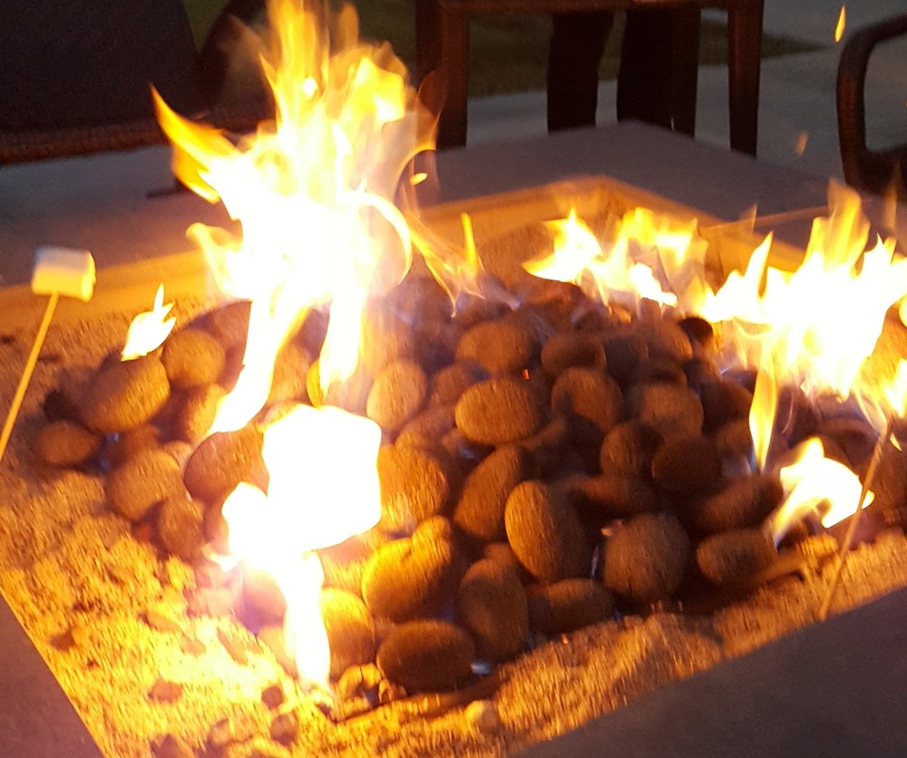 Carefully planned work schedules leave time for family gatherings like s'mores around the firepit.
