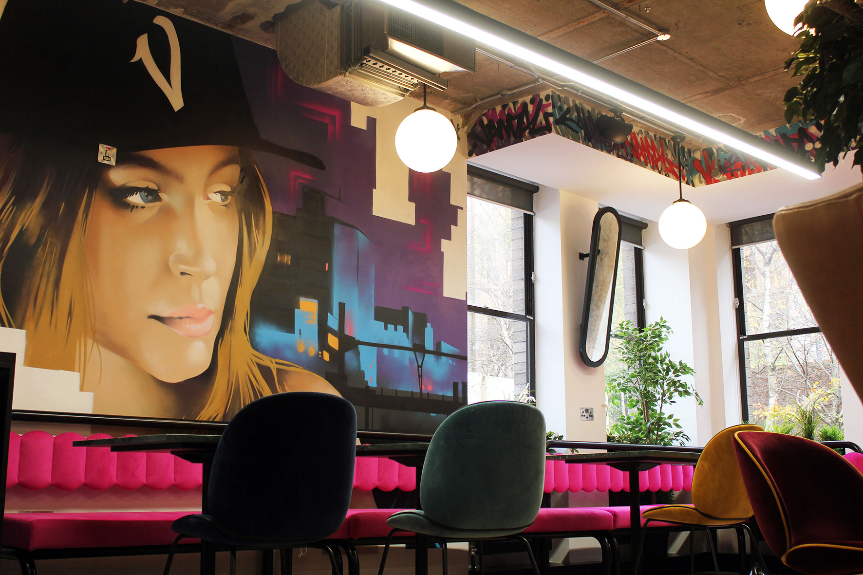 Iconic Offices' location at The Greenway utilizes original art, bright colors and expressive design through its workspace and common areas.