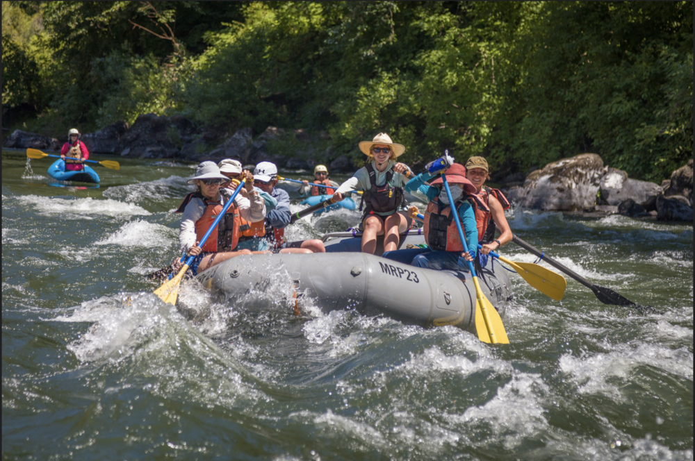 Guiding a boat full of guests on the Rogue River. I worked as a river guide for close to a decade, helping people overcome fears and enjoy the outdoors.