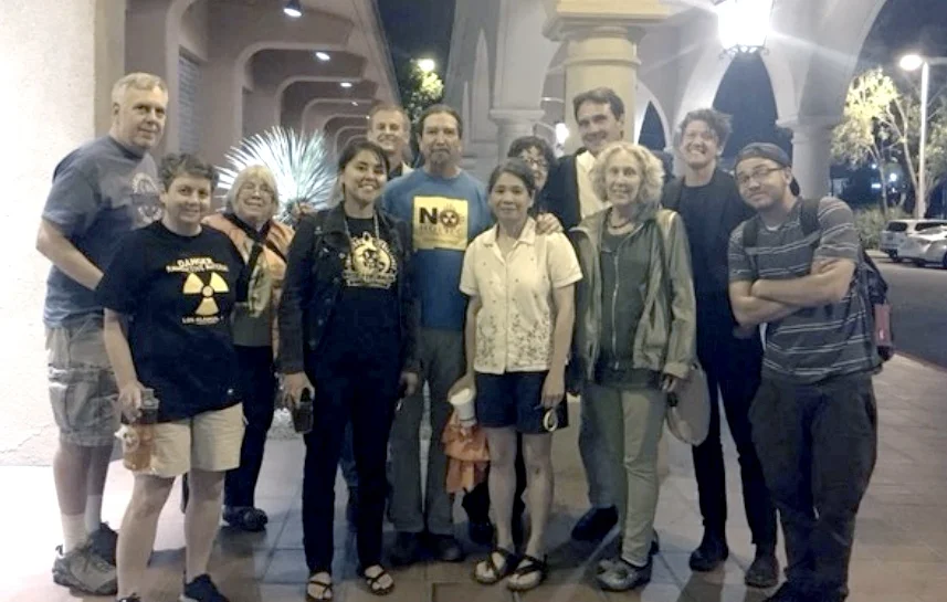 Interstate solidarity against consolidated interim storage (CIS) – activists from New Mexico, Texas and California. (from left) Ace Hoffman(CA), Sharon Hoffman(CA), Rosemary Blanchard, Leona Morgan, Nick Maxwell, Noel Marquez, Hanh Nguyen, Sue Schuurman ( behind Hanh next to Torgen) Torgen Johnson(CA), Robin Seydel, Cal McManus, Cody Slama. Photo: Anon.