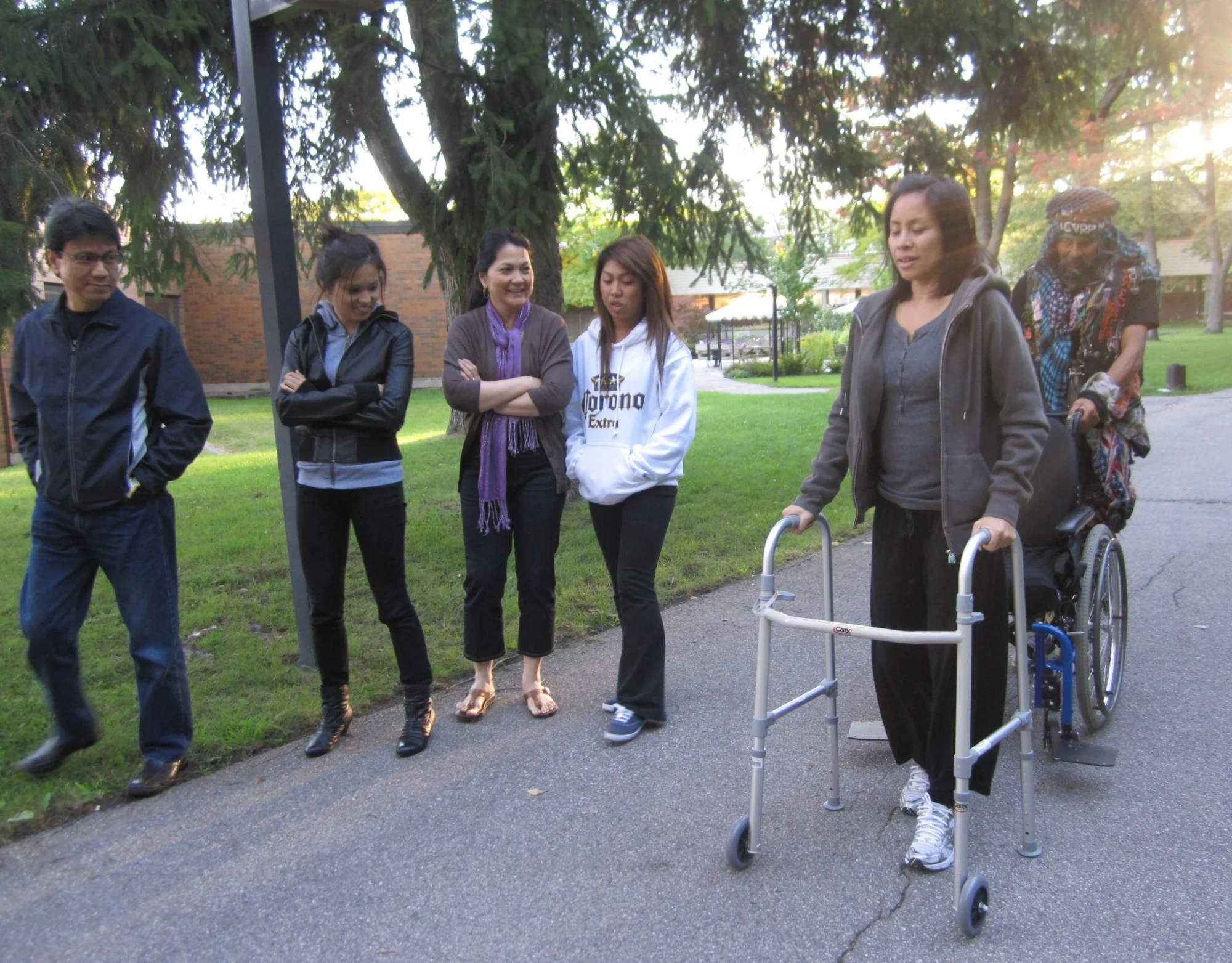 Learning to walk again with the support of my family.