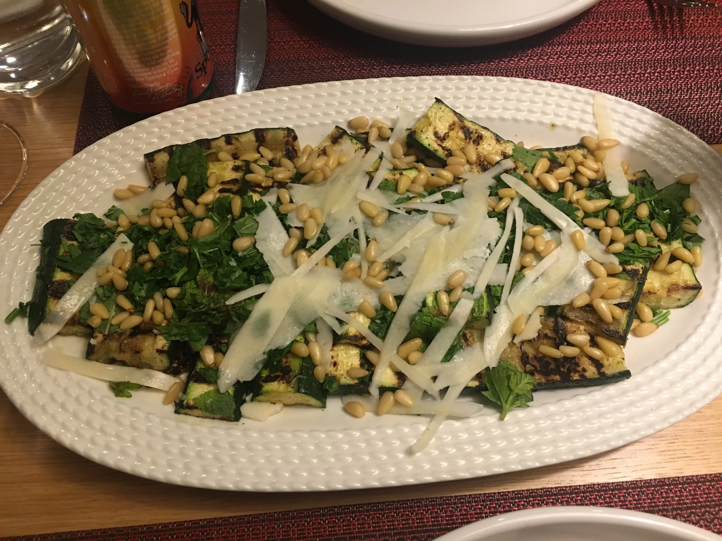 Zucchini salad with pine nuts, cheese