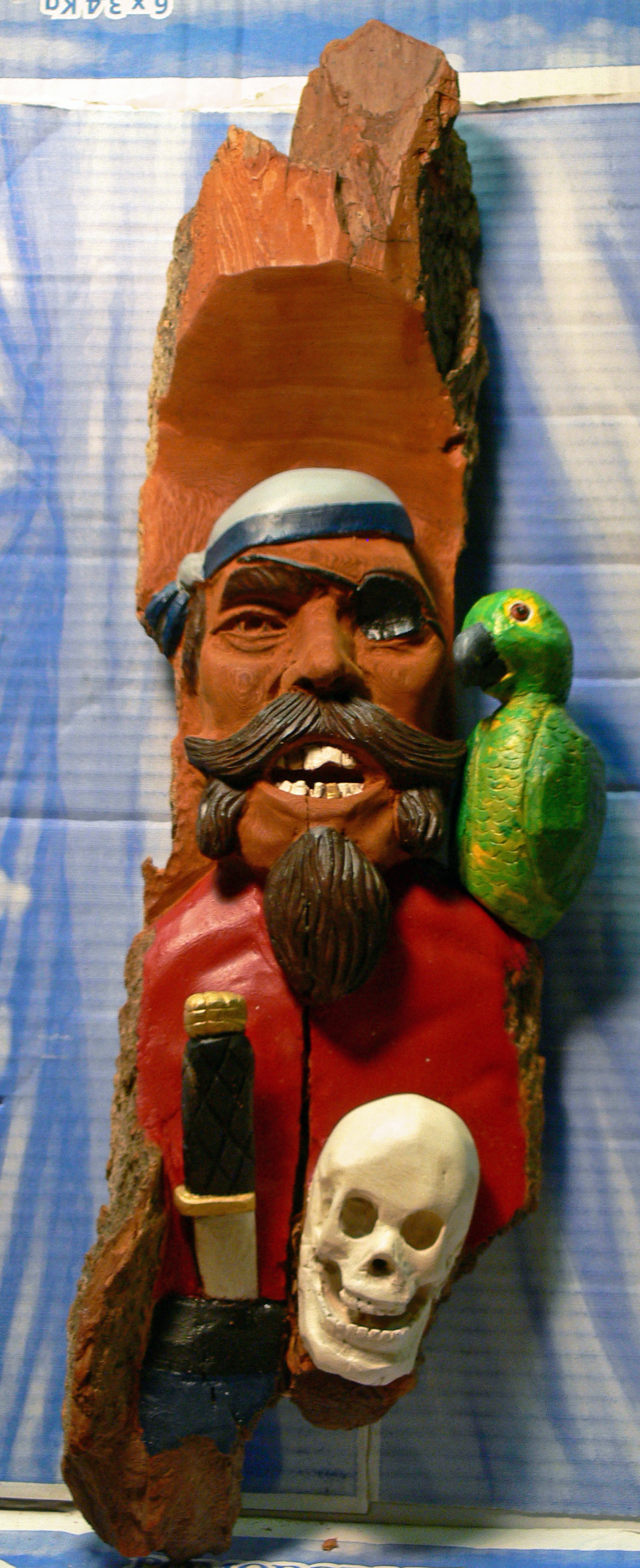 "AYE" bark carving by Gus Ginart
