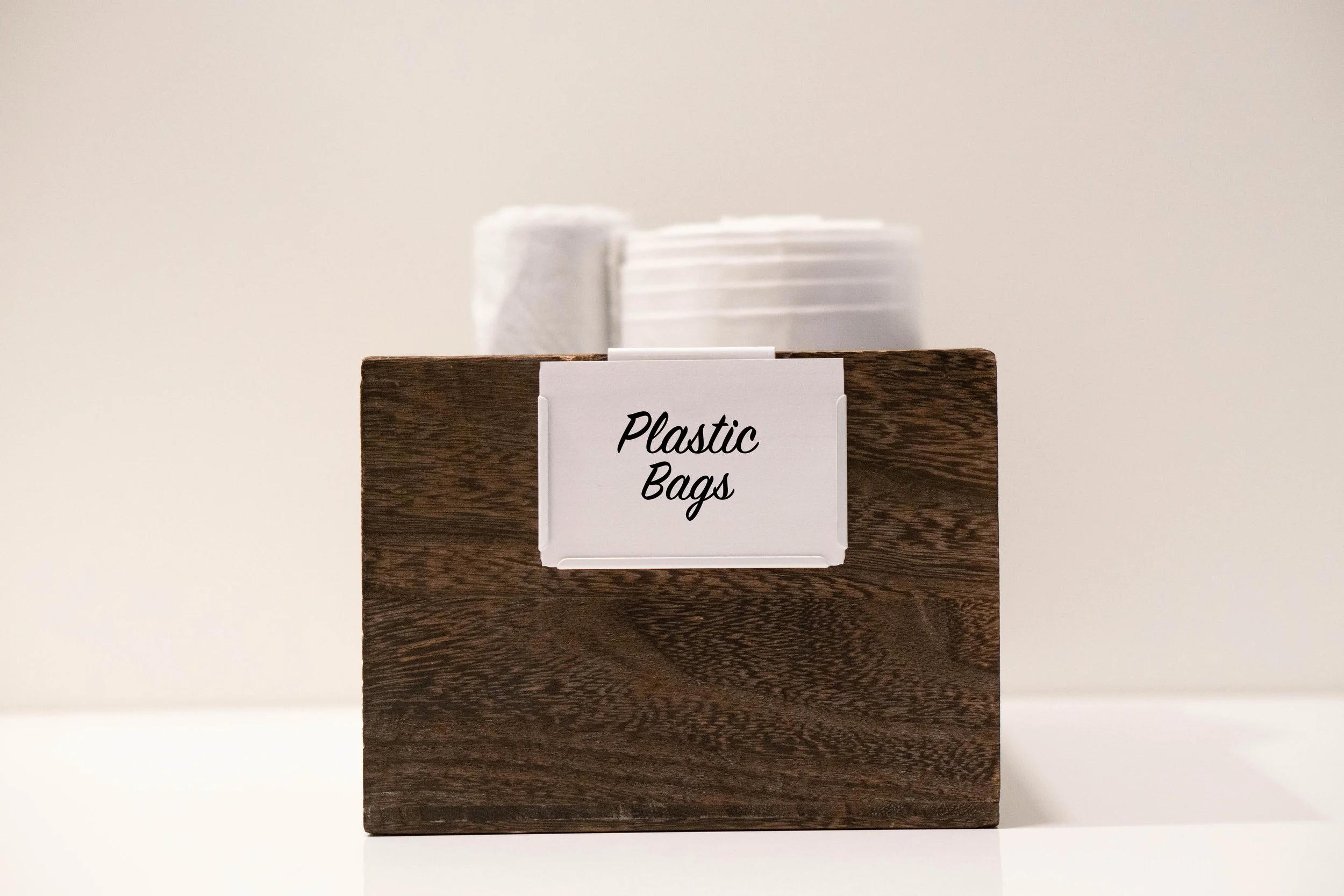 Tip #3: Label, label, label! We live by the motto “A place for everything, everything in it’s place.” Adding labels ensures items will make it back to their place. For certain areas storage needs are ever changing. Using bin clips like the one above allow you to easily switch out the insert as the contents of the container change. This style can be found at The Container Store and comes in a variety of colors.