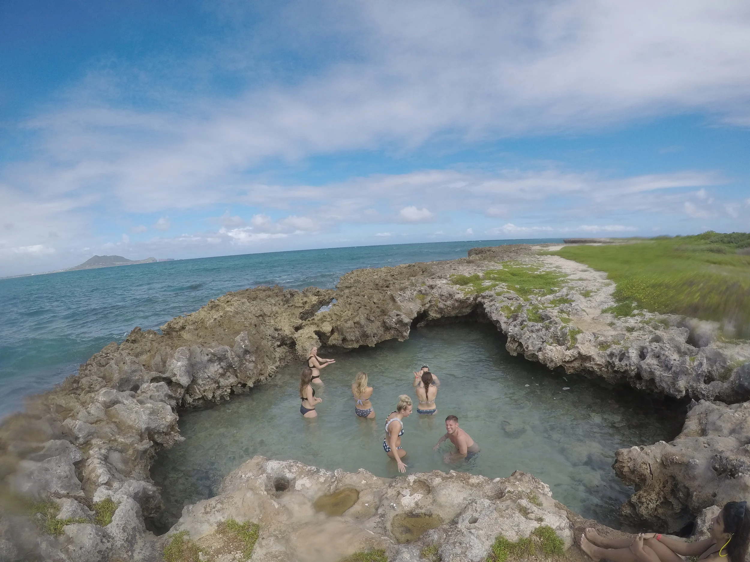 people in tide pool flat island.JPG