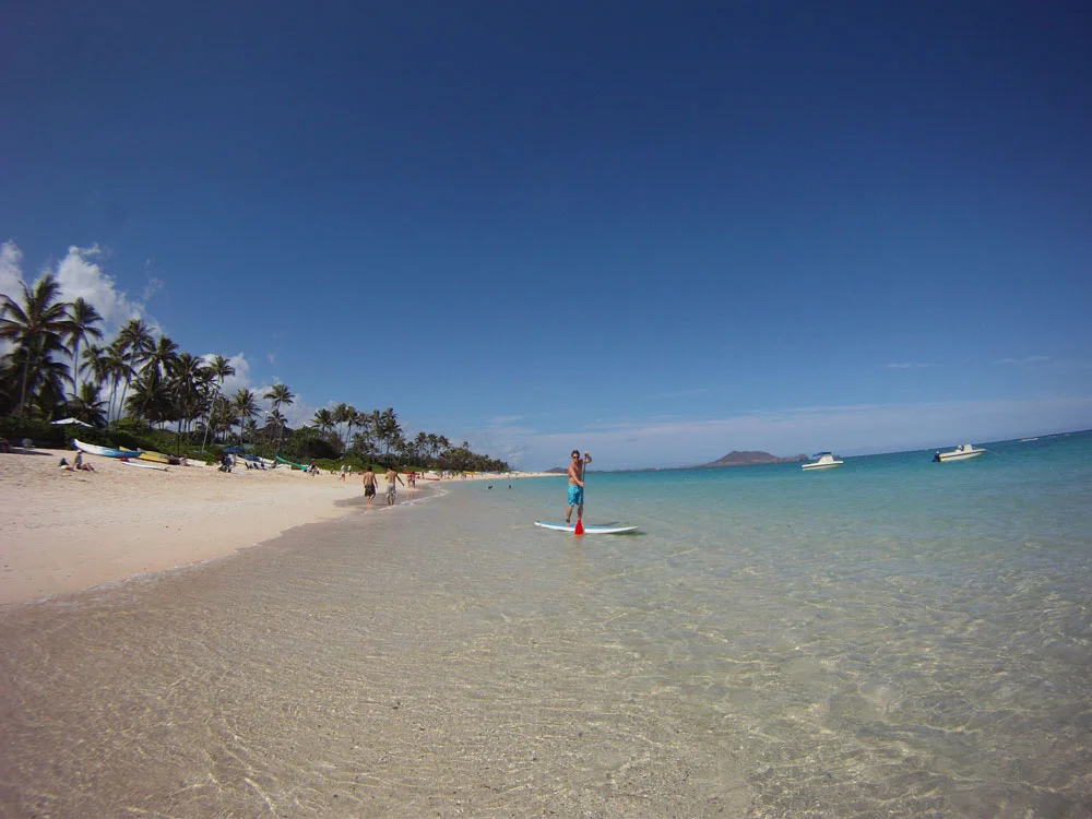 stand up paddler launching from Kailua Beach