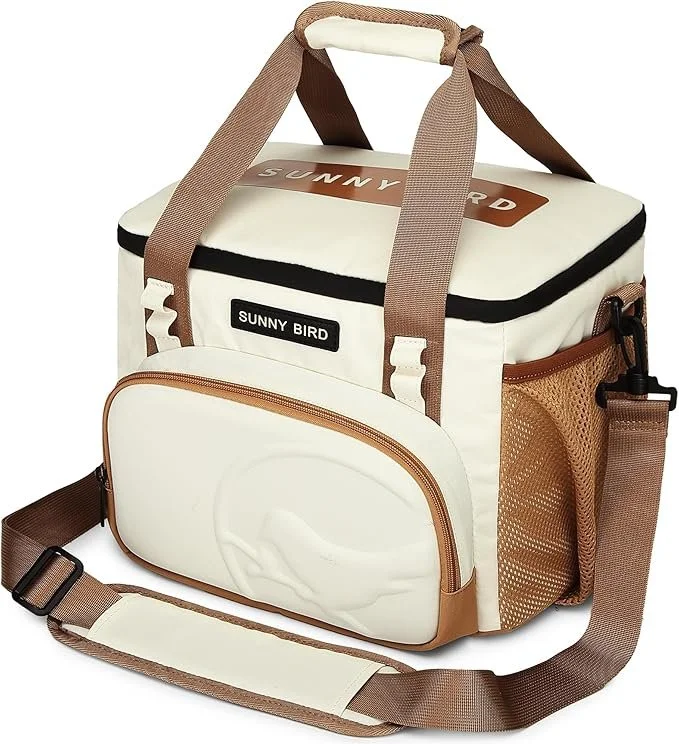 Cream-colored insulated cooler bag with brown straps and accents, featuring a front zippered pocket and side mesh pocket, branded with a black label that says 'Sunny Bird.'