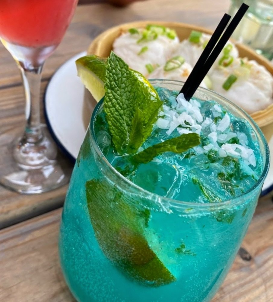 Craving a taste of paradise? Our blue thai mojitos cocktail is just what you need! 🏝️🍹 Made with the finest ingredients and served with a smile, it&rsquo;s the perfect way to unwind and soak in the flavors of the tropics. Treat yourself to a little