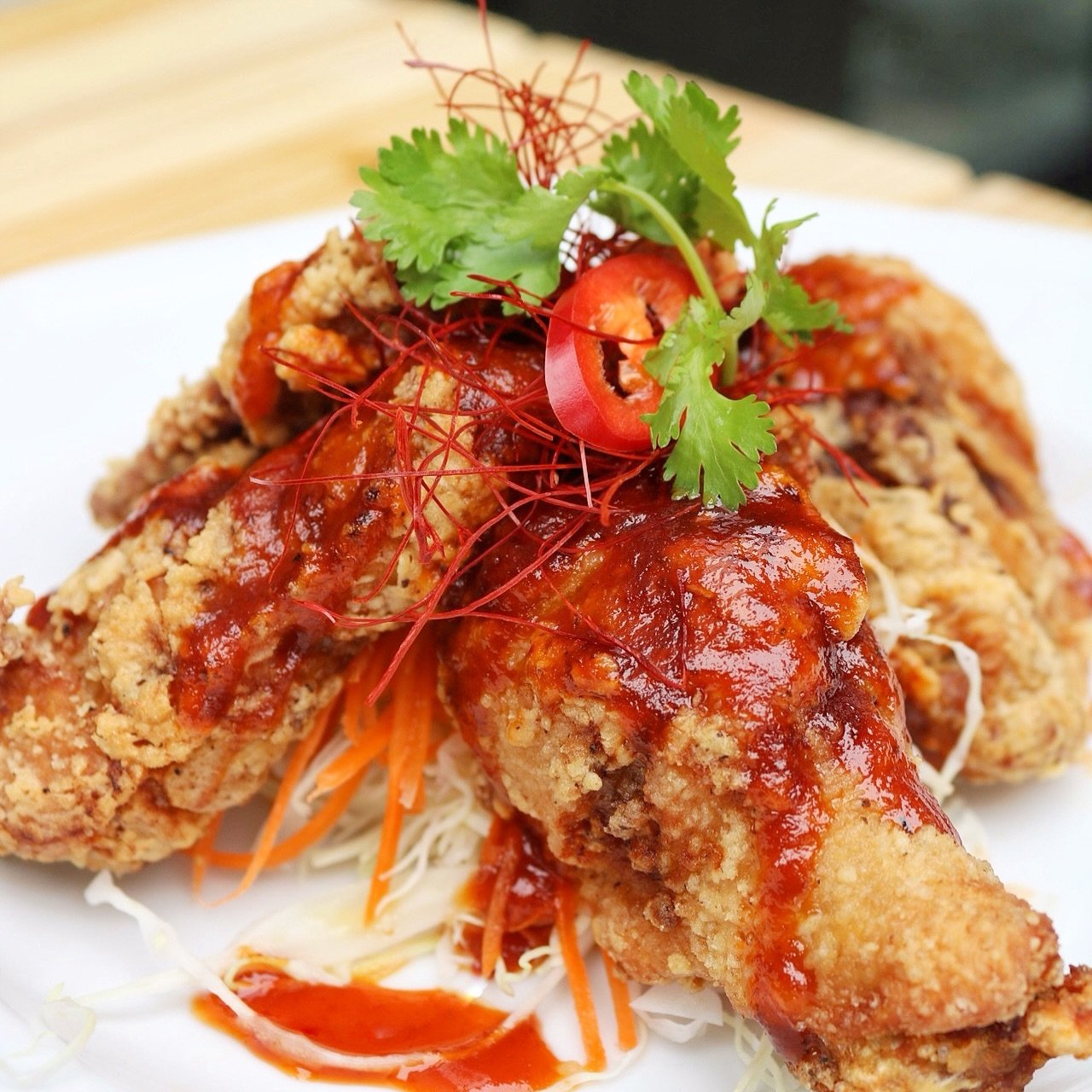 Craving crispy perfection? Dive into our Thai Style Fried Chicken Wings, served with our house-made spicy, sweet &amp; sour sauce! 🔥🍗 Indulge in the ultimate flavor fusion that&rsquo;ll leave your taste buds begging for more!
.
.
. #FriedChickenWin