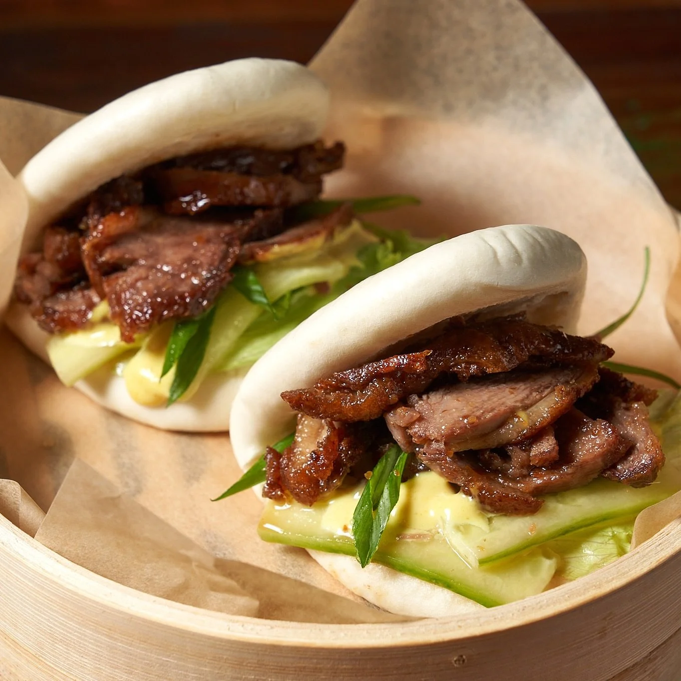 Juicy duck, crisp veggies, creamy mayo, mustard &amp; our house special sauce &mdash; all in a soft fluffy bun.

One bite = pure happiness. 🥢✨

#CrispyDuckBun #BaoTime #FoodieHeaven #DuckLovers