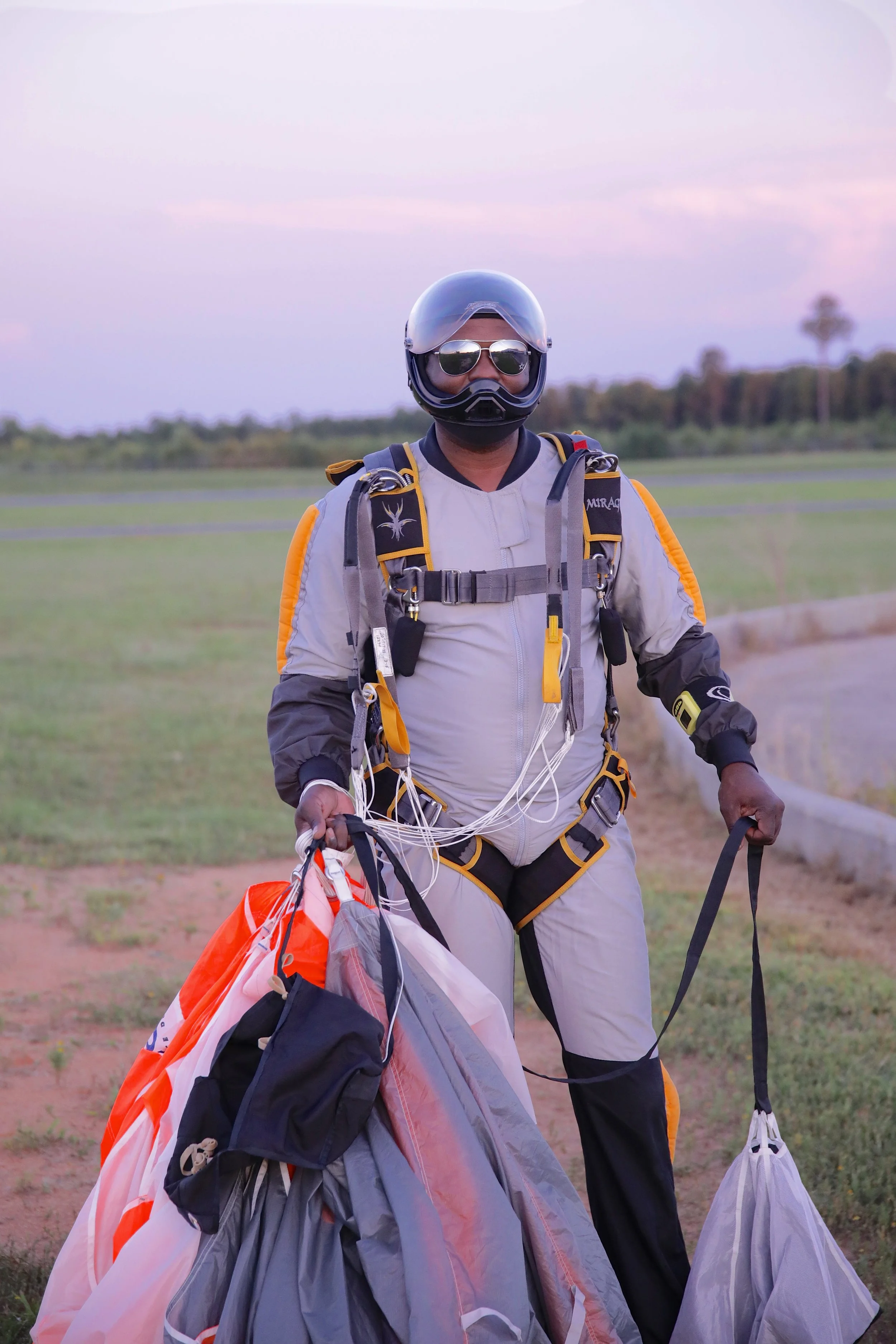 Ken poses for a photo with his Spectre 190 canopy after landing at his home drop-zone in North Carolina. This photo and the banner photo are both courtesy of Jim Wisely.
