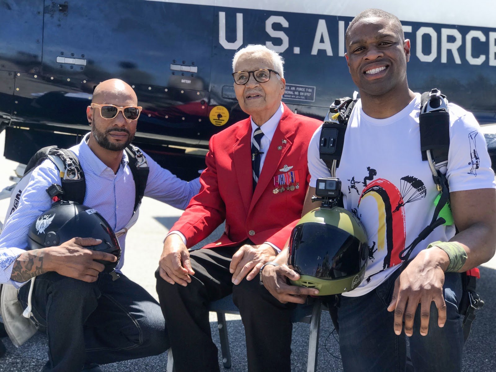 COL McGee flew a total of 137 combat missions during WWII as a member of the famed Tuskegee Airmen. Here he poses for a photo with Waz Choudhry (left) and Emanuel Brice (right) of Team Blackstar Skydivers. Photo courtesy of Danielle Williams