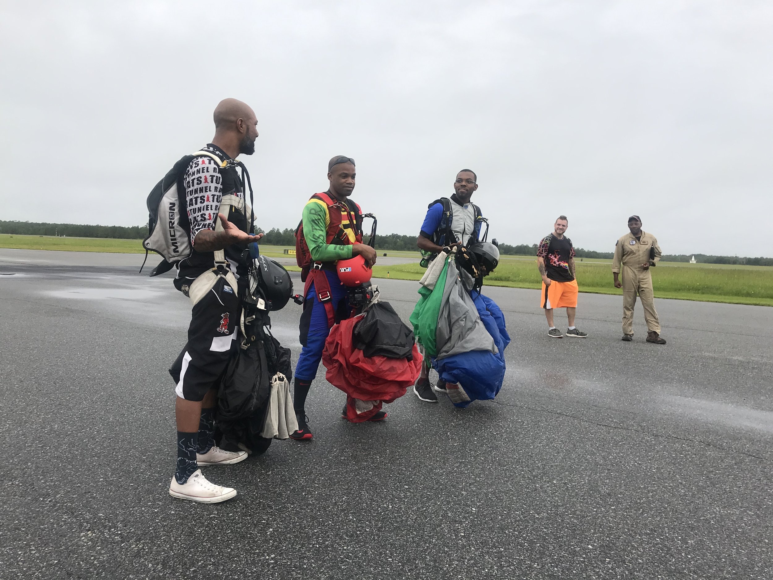  After a successful landing the skydivers briefly answered questions on the ramp.  Photo courtesy of Danielle Williams   