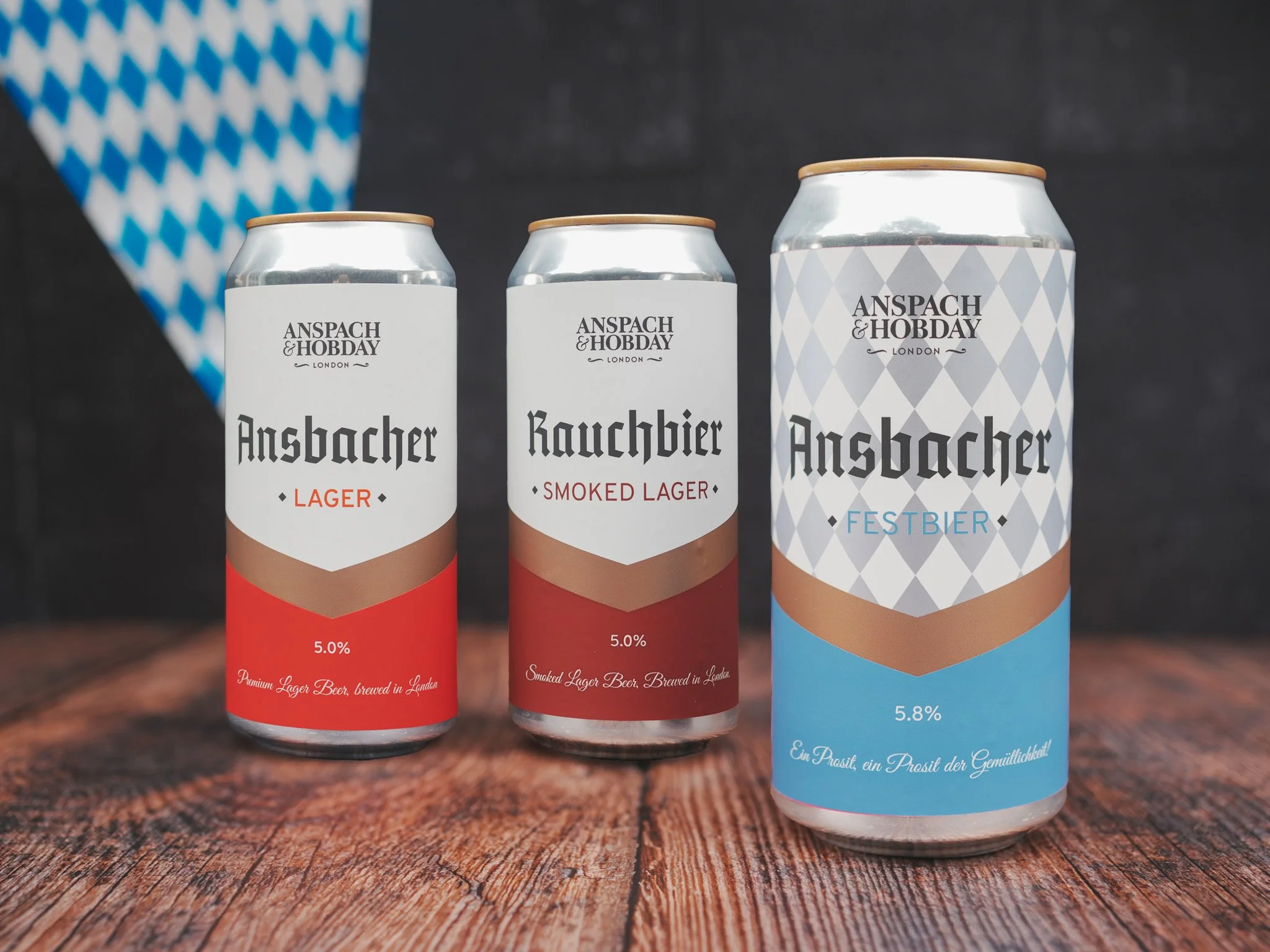 OKTOBERFEST TRIO 2026 Product Photo Can + Beer July 03, 2024.jpg