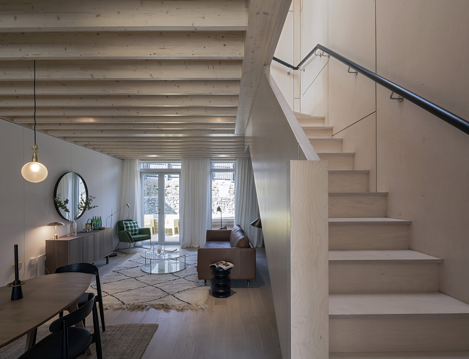 For example, the timber ceiling joists in the modular cassettes of the floor plates have been exposed, a strategy which increases floor to ceiling heights to 2.88 metres, whilst ensuring material continuity with the birch-faced plywood staircase, which is treated as a sculptural object inserted into the open-plan reception space.