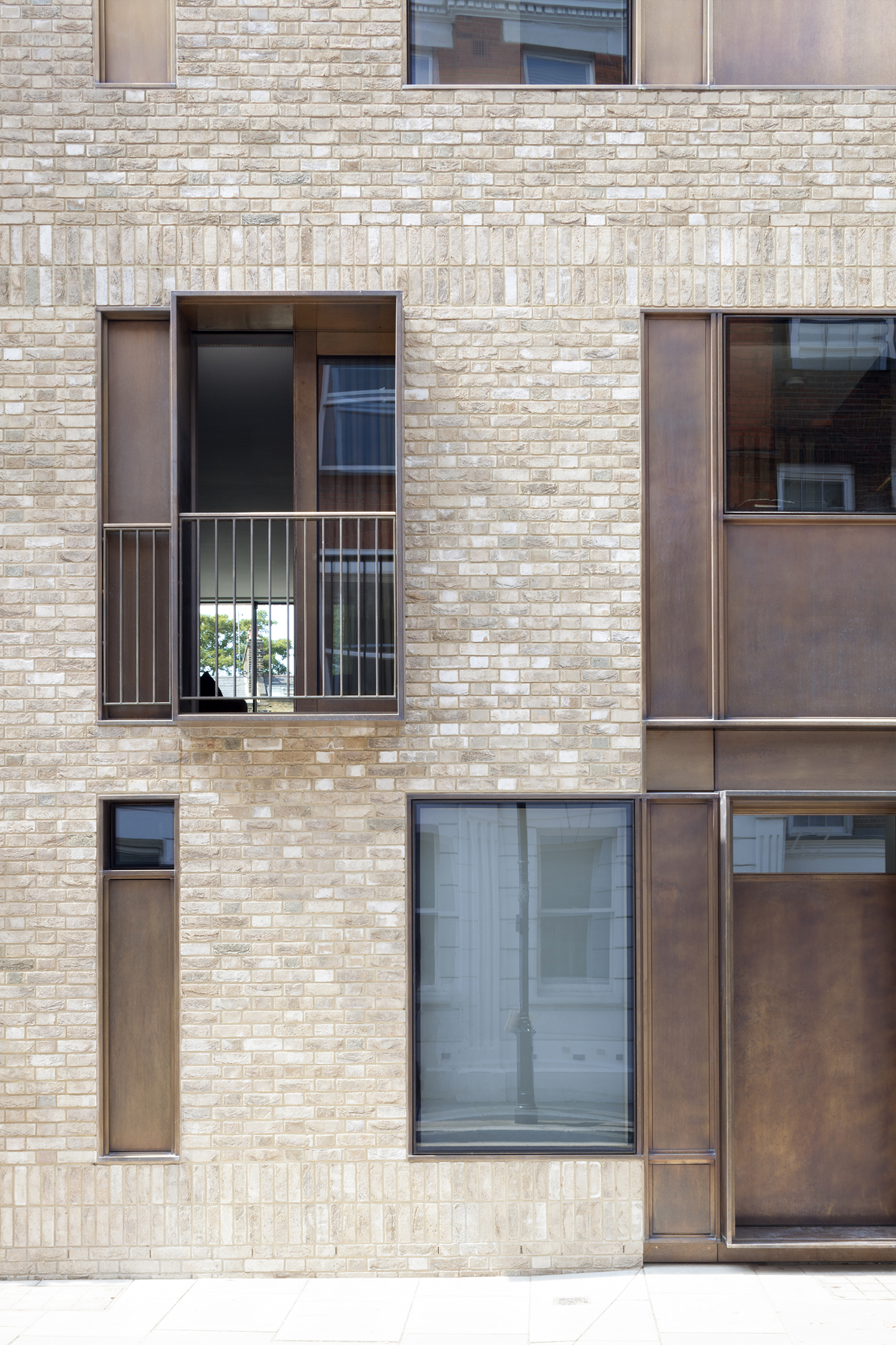 The design responds to the elevational rhythm present in the street. This sets out a grid, within which differing scales of fenestration reflect the uses of the rooms inside: