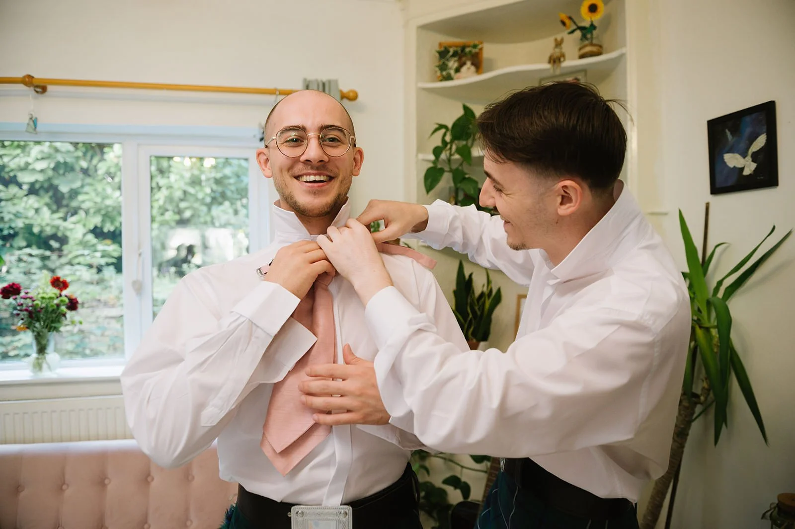 Groom getting ready at home in Nottingham before Wollaton Hall wedding