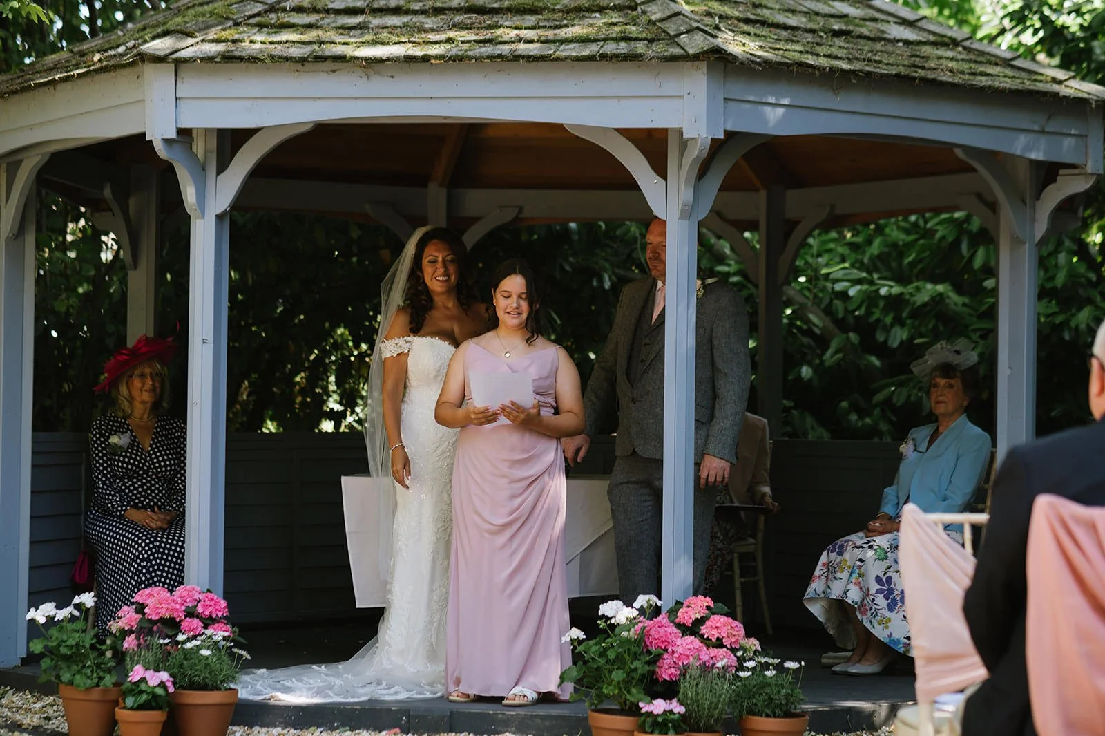 Children giving reading during wedding ceremony