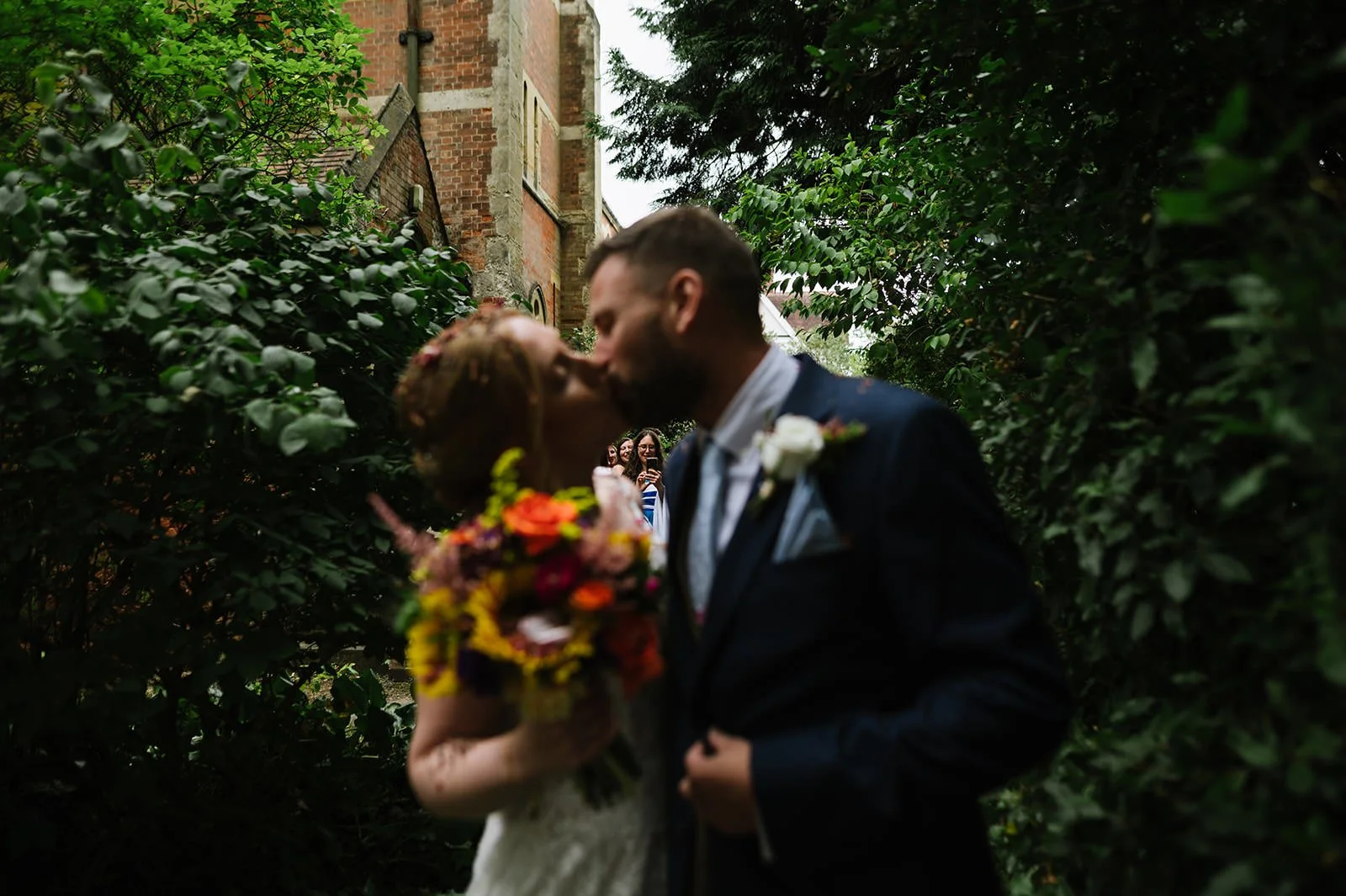 Bride and groom leaving Leicester church wedding