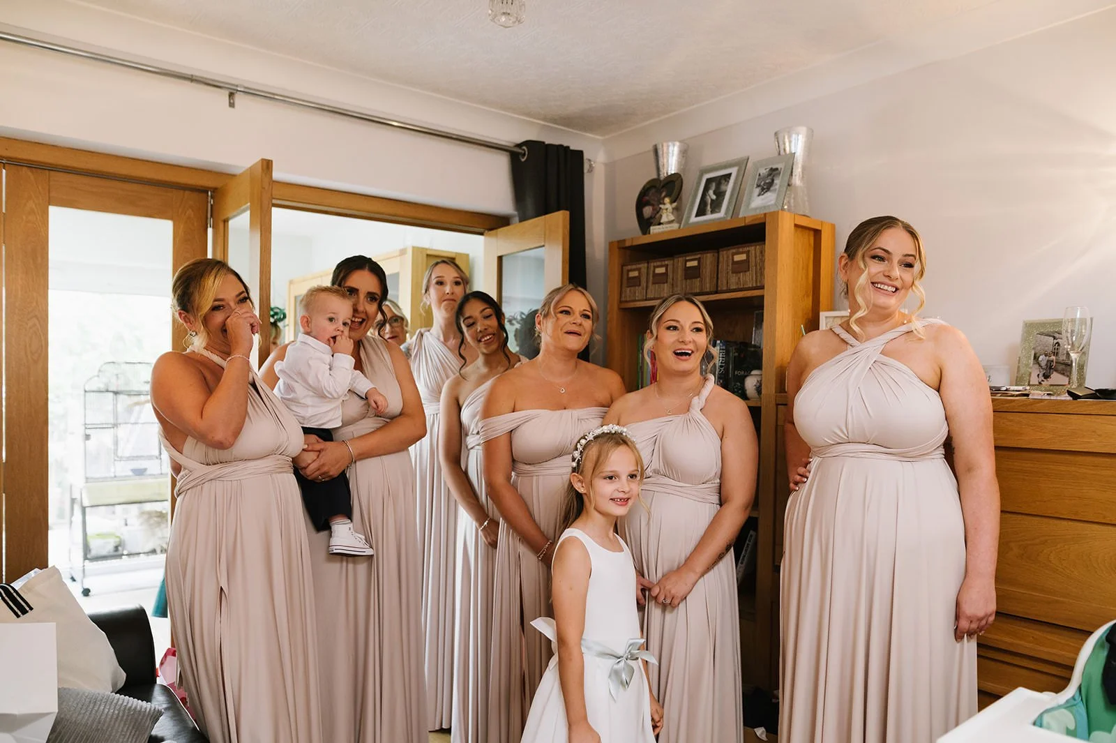 Bride getting ready with friends and baby at home