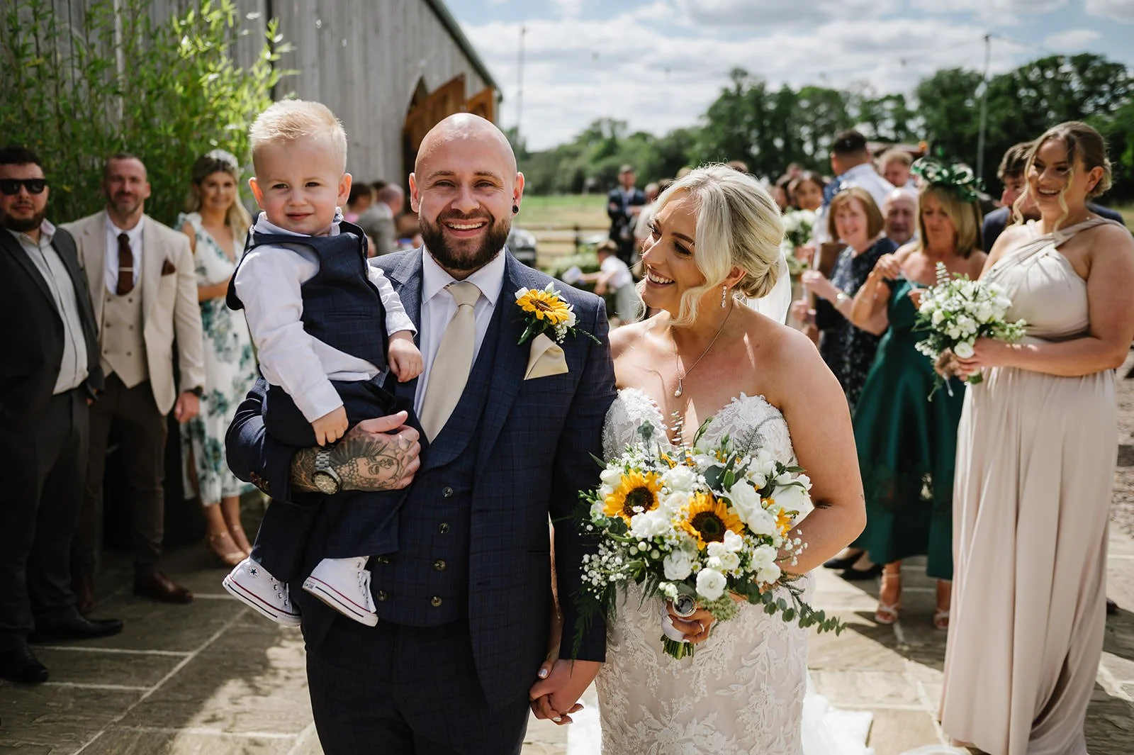 Bubble exit at Bilston Brook Barn wedding with family