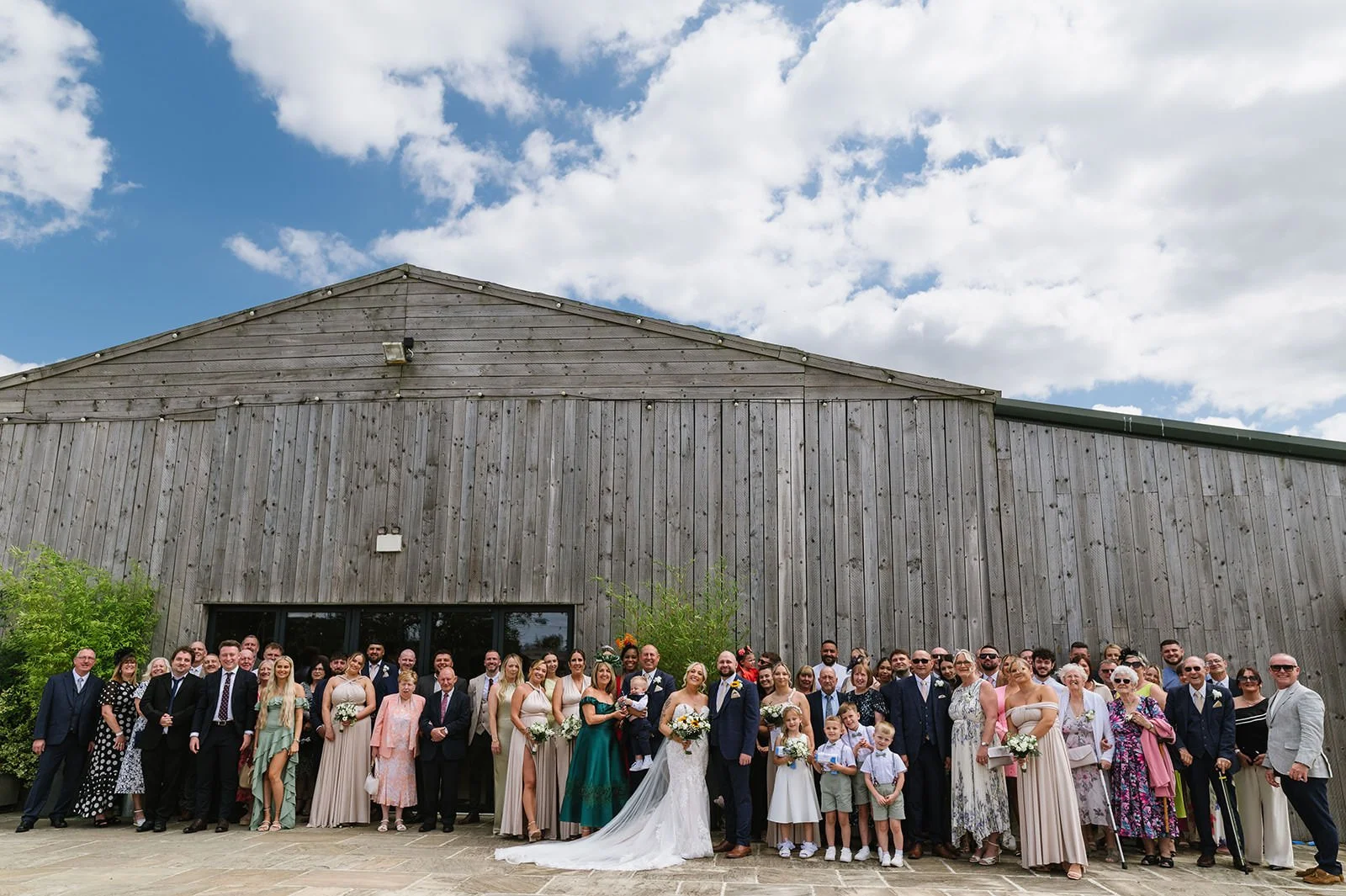 Large group photo at Bilston Brook Barn wedding