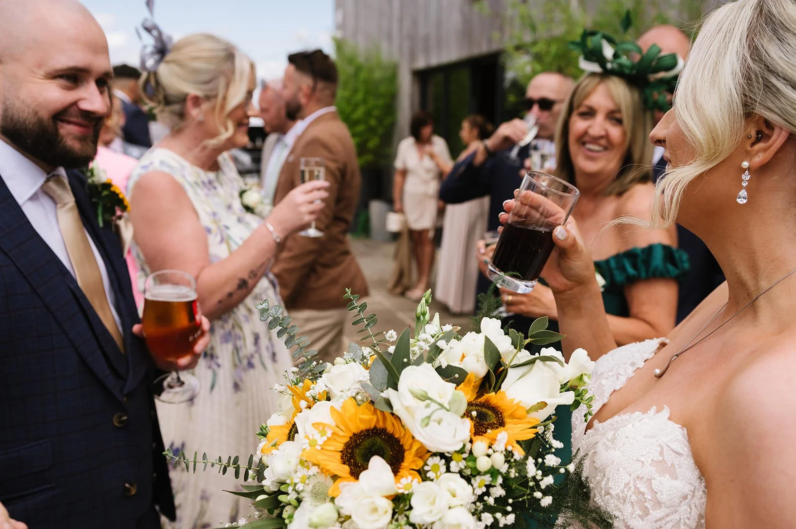 Guests relaxing outside in the sunshine at Bilston Brook Barn