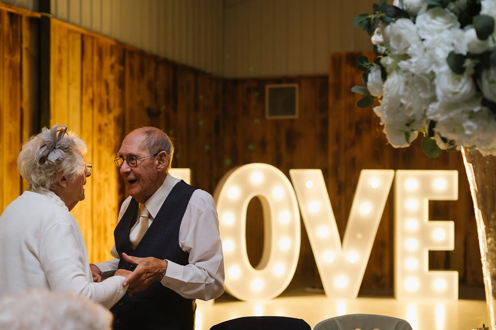 Grandparents dancing at a family wedding reception