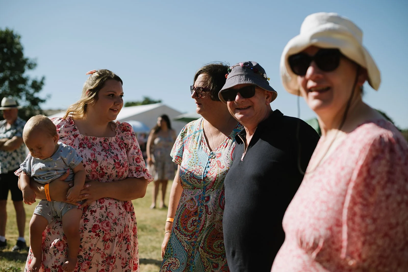 Guests arriving at a DIY field wedding reception