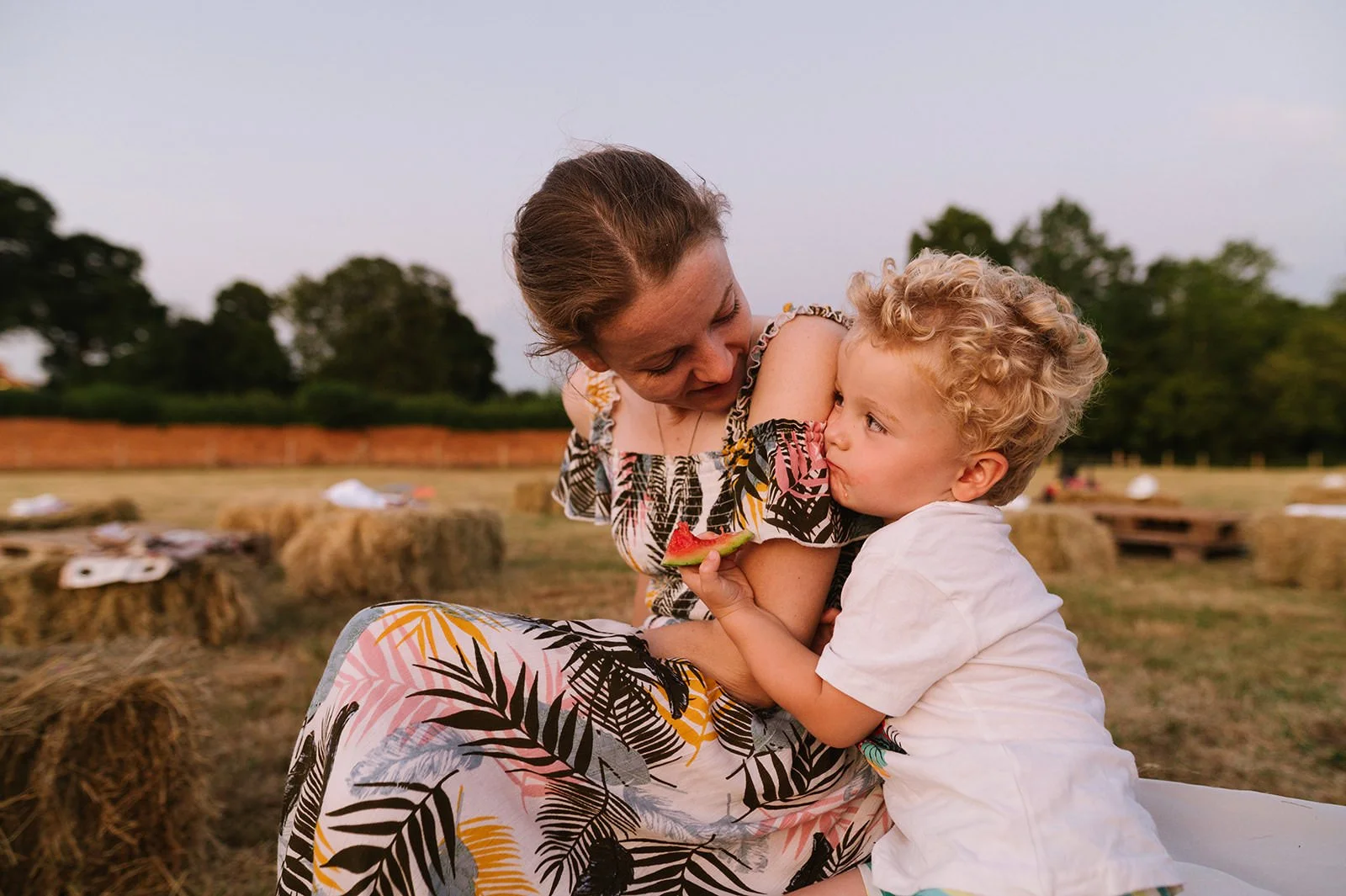 Children playing games at a family-friendly field wedding