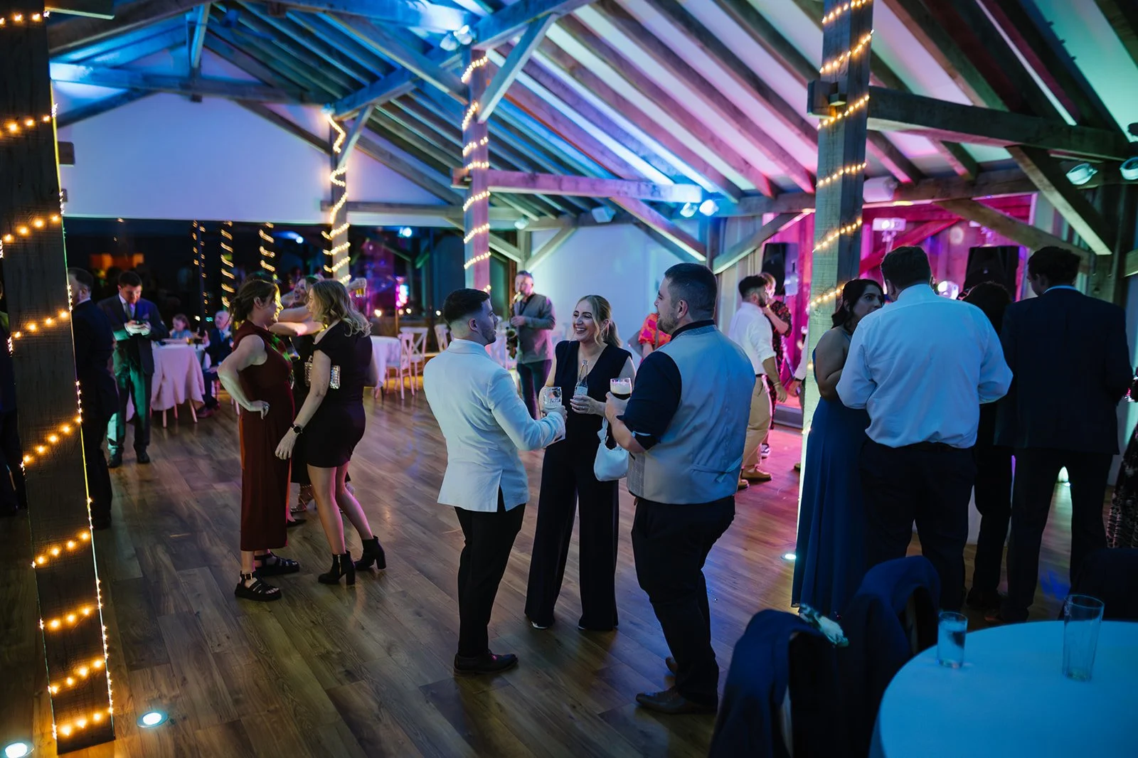 Evening guests outside enjoying sunset at Bredenbury Court Barns
