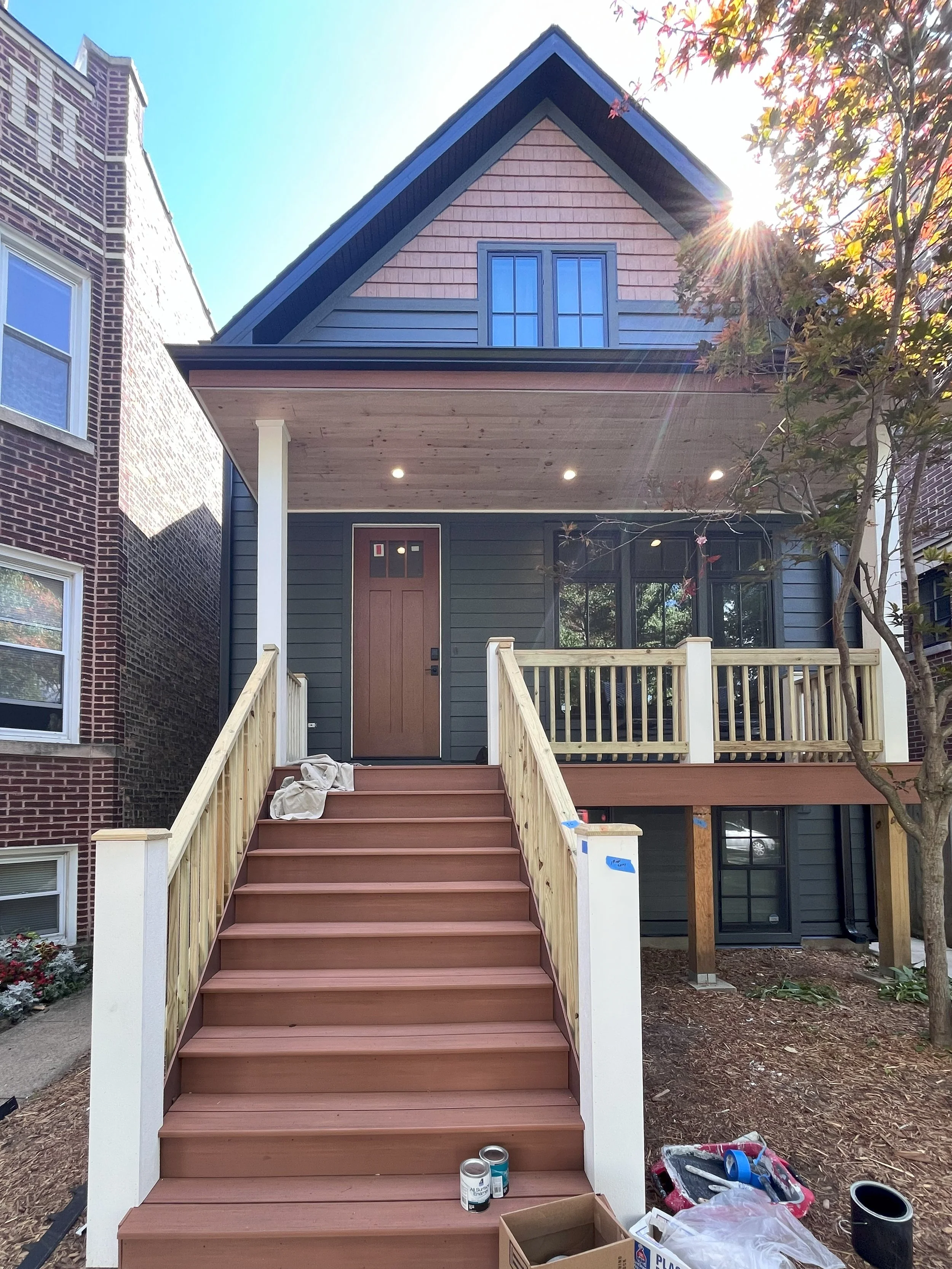 The project under construction, showing Hardie siding and shake shingles