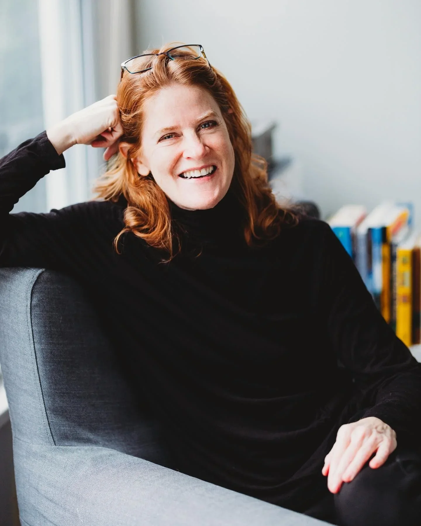 Natural indoor professional headshot of a woman in Burien, photographed for LinkedIn with a relaxed, approachable expression