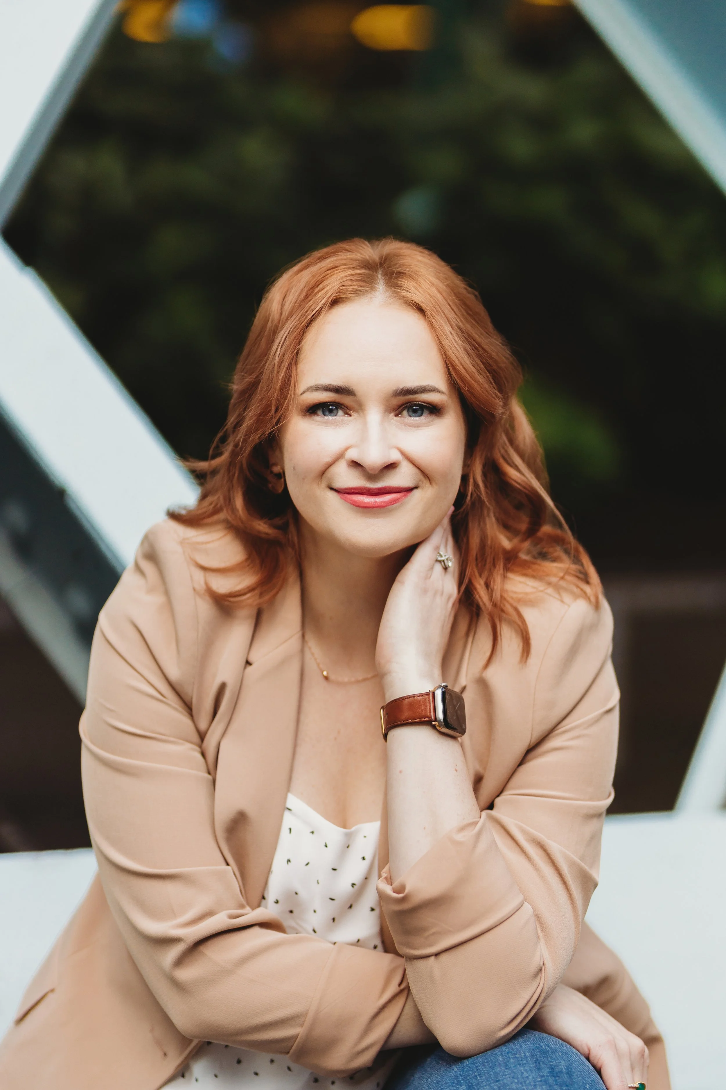 An urban professional headshot photographed in natural light in Seattle, featuring clean lines, soft styling, and a relaxed, confident expression.
