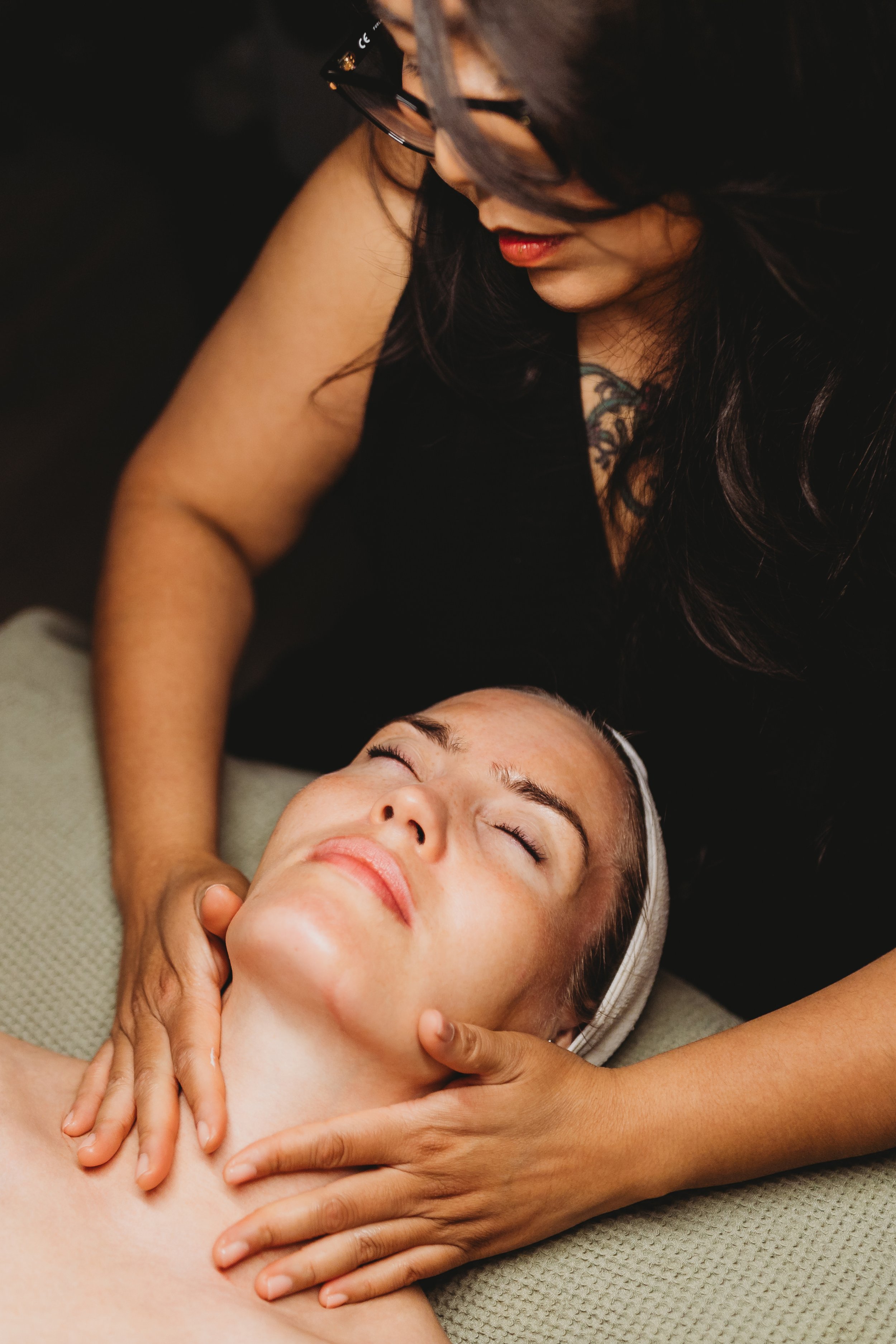 Professional branding headshot detail for a Seattle facialist, highlighting real skin texture and human connection