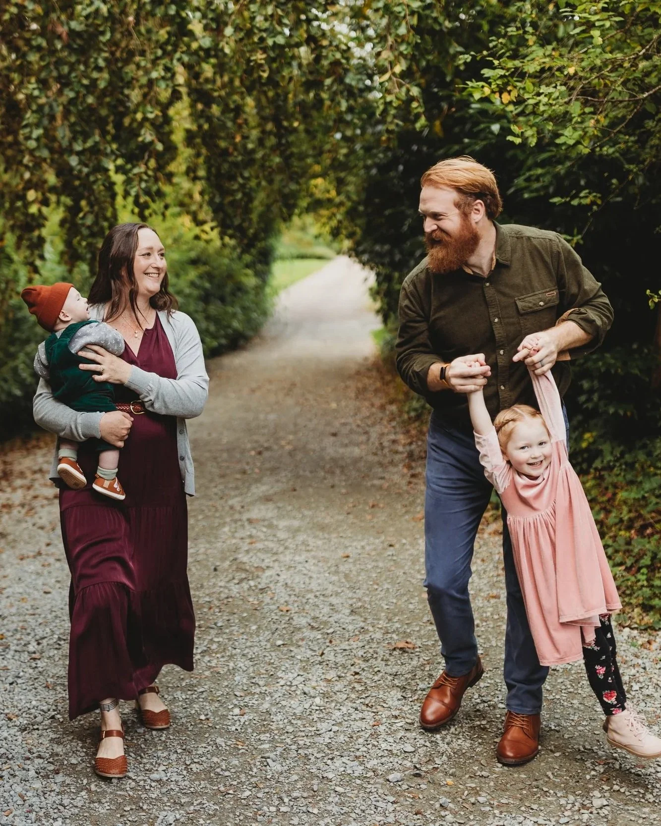 Seattle family photographer — lifestyle family session at Kubota Garden, family laughing on a forest path