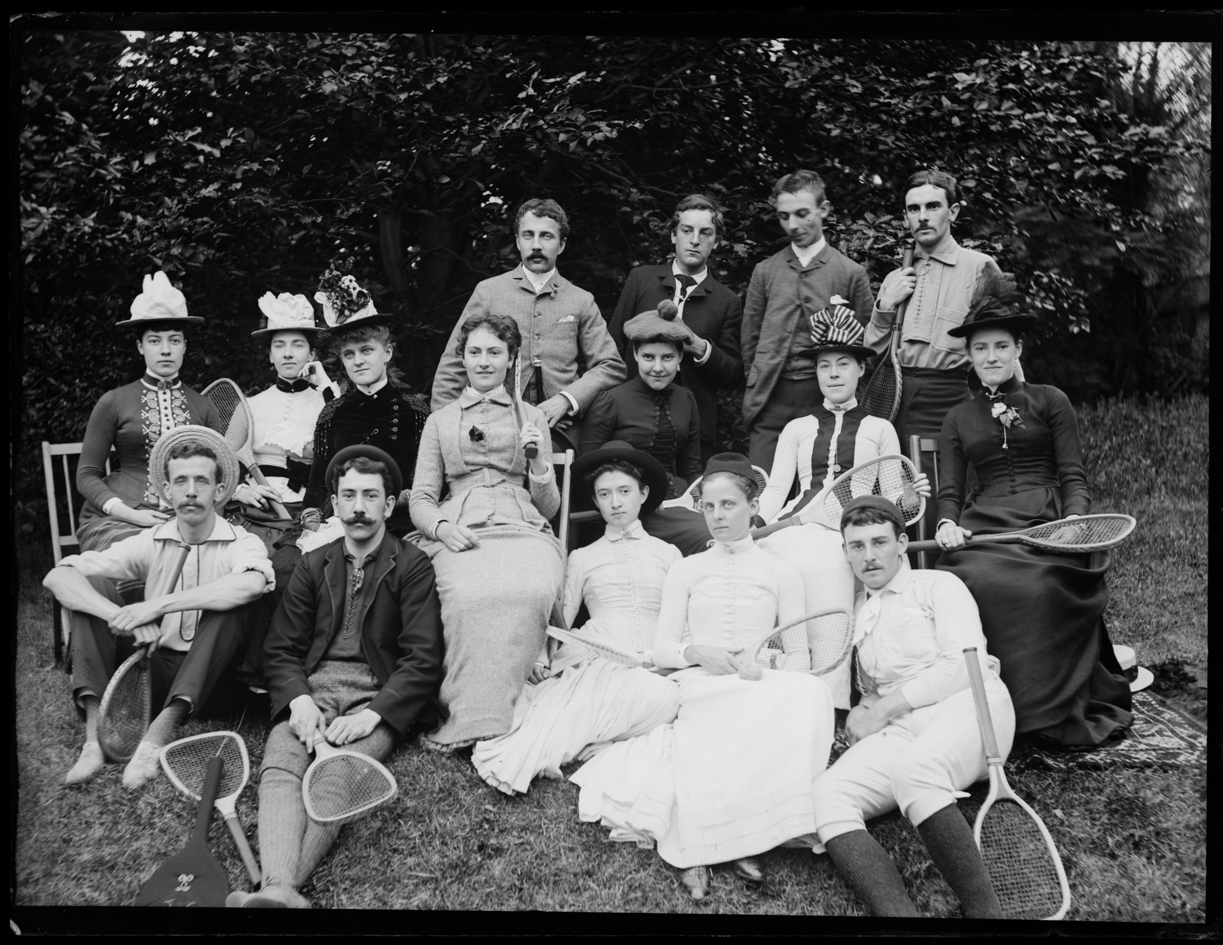 “Large group on tennis ground,” Clear Comfort, August 5, 1886. Alice Austen is seated at far left.