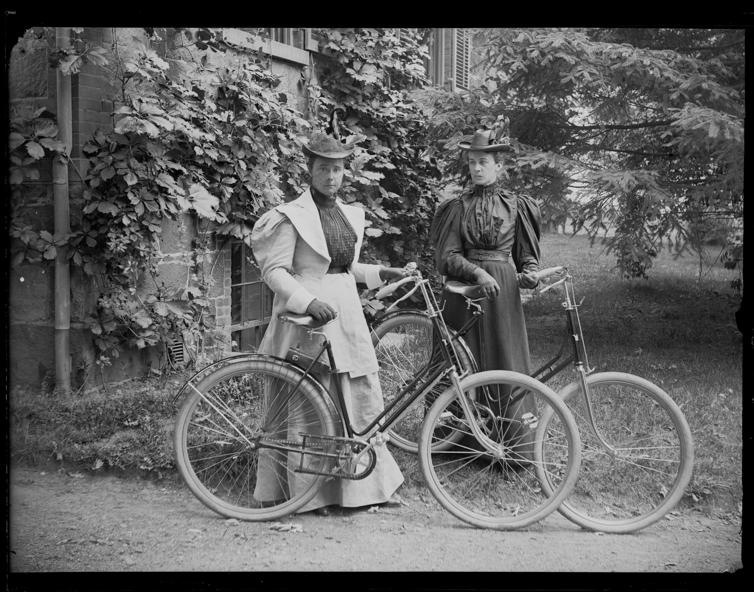 Violet Ward and Daisy Elliott with bicycles, Staten Island, ca. 1895.